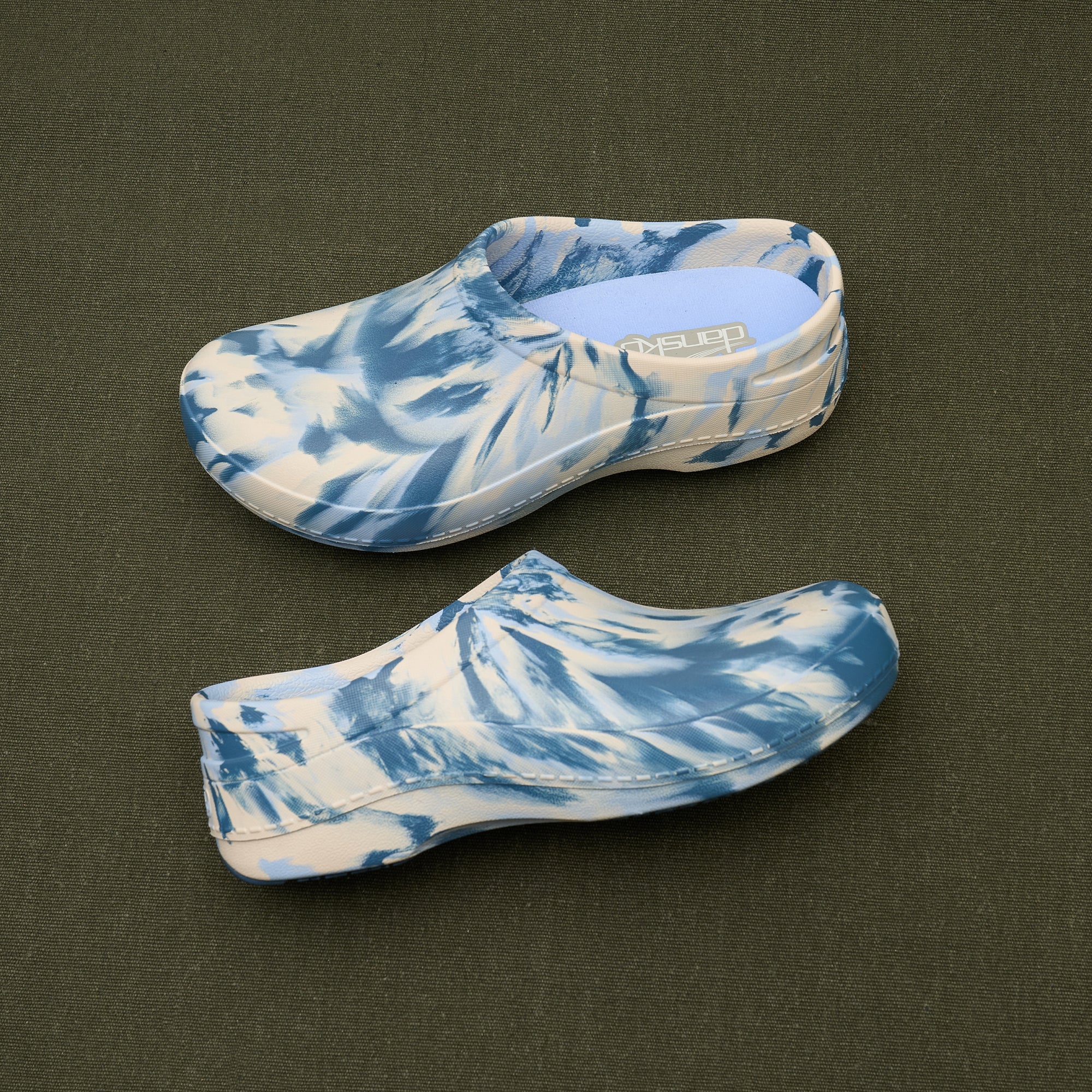 Blue and white tie-dye molded clogs with cushioned footbeds.