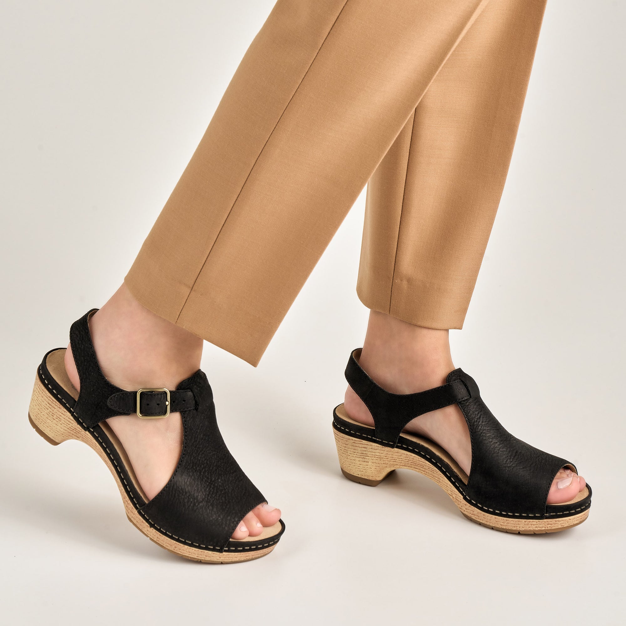 Close up of black open toe mary jane.