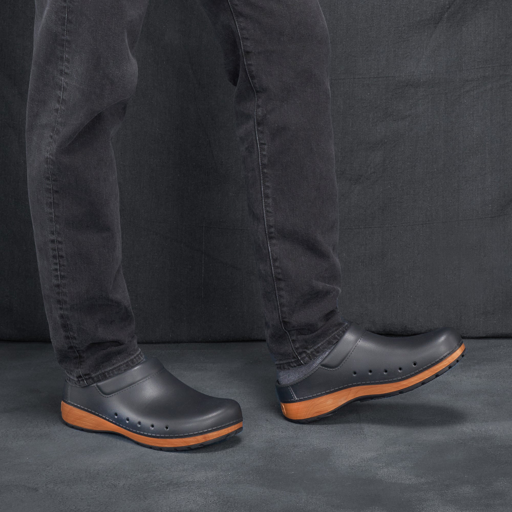 Black men's EVA clogs worn in a casual setting.