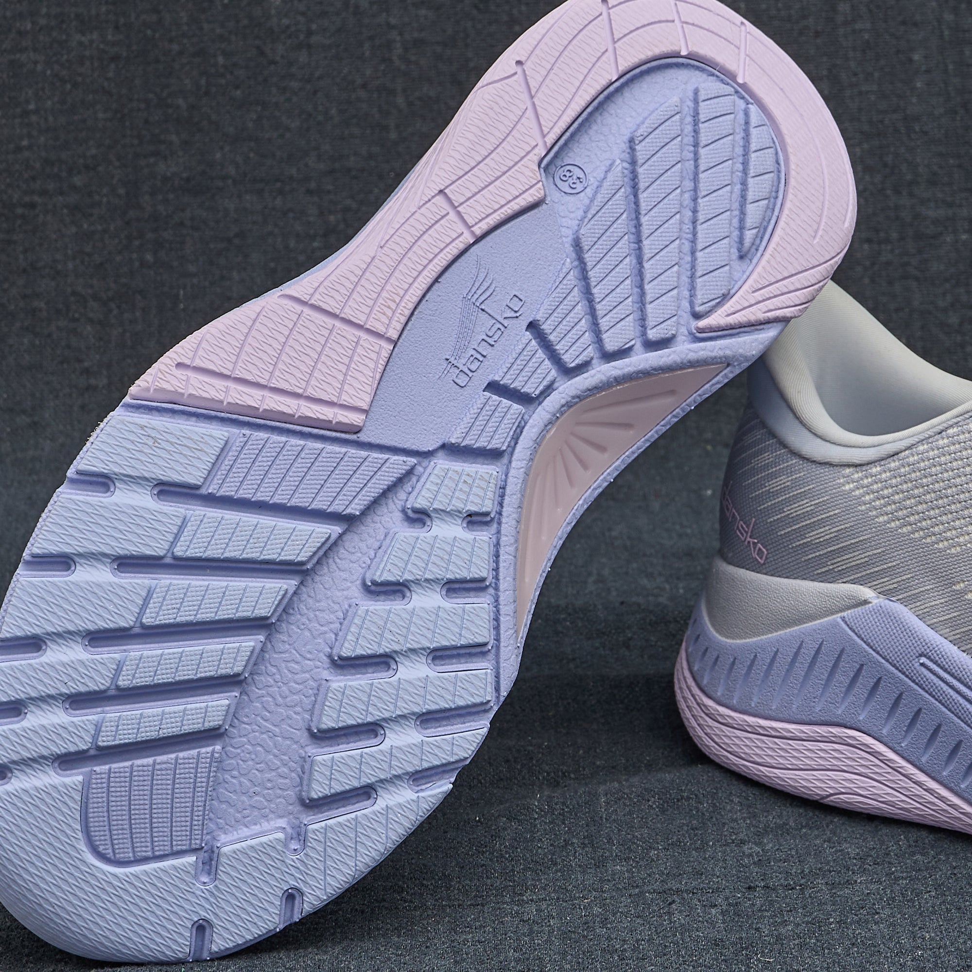 A closeup of our active walking sneakers closely showing the design and pattern of the EVA outsole.