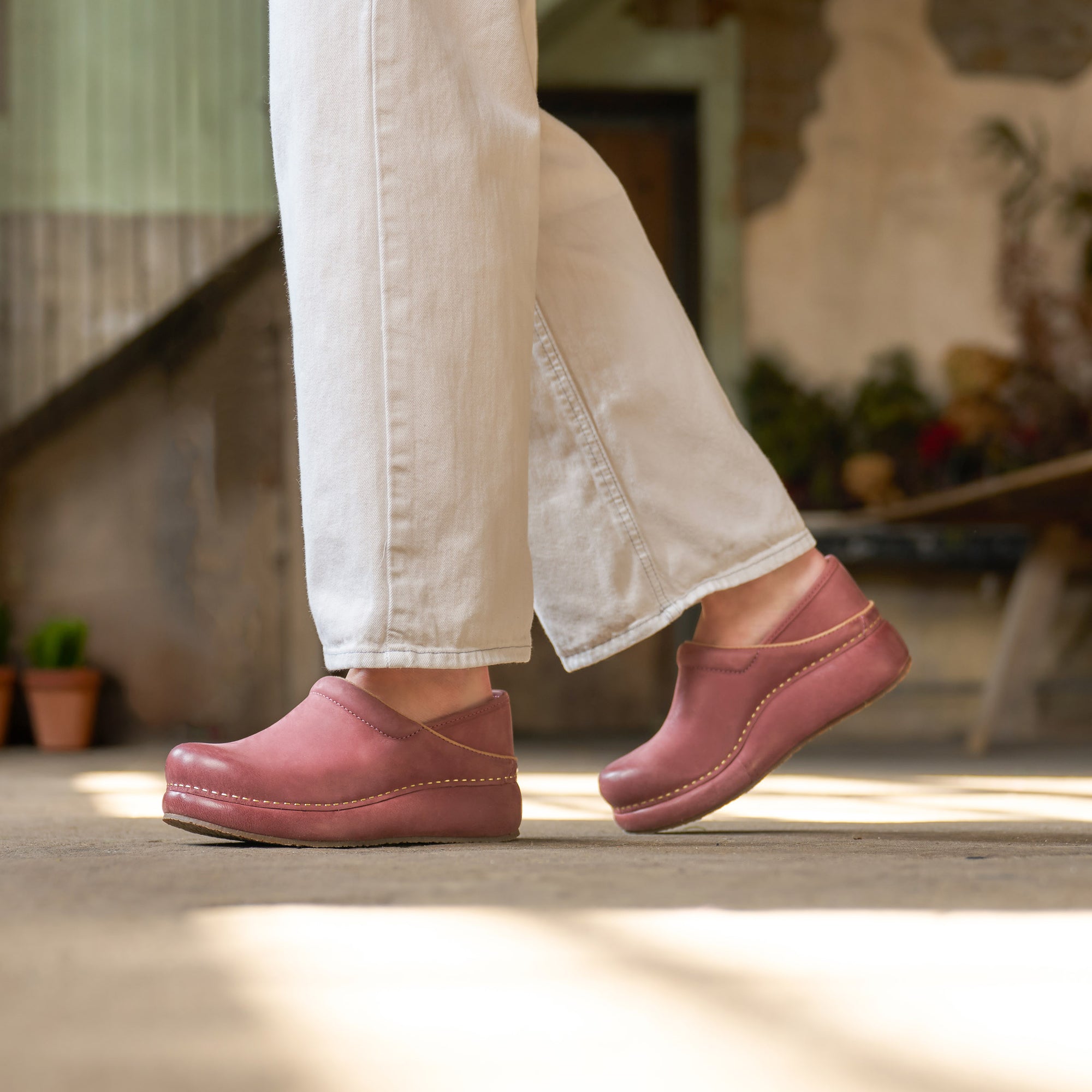 Close up of rose platform Dansko clogs.