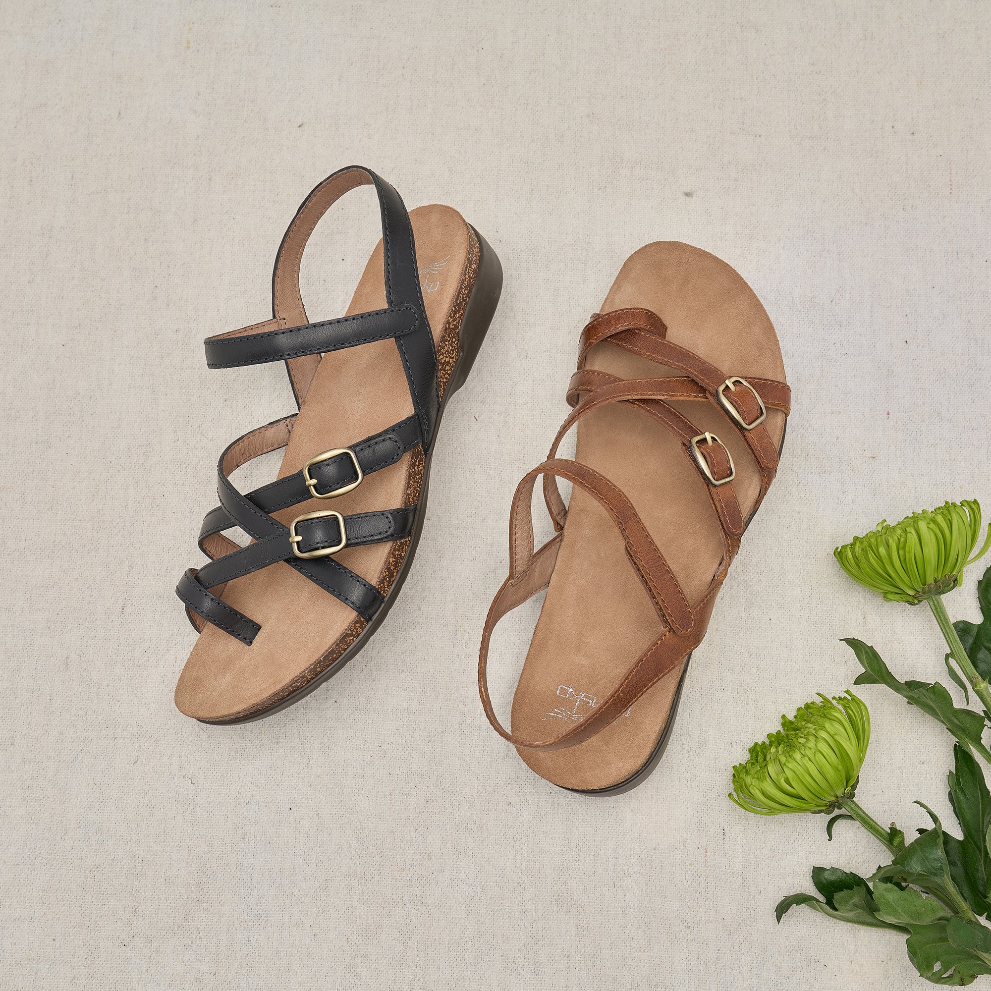 Two different colored leather uppers on a cork-sole flat sandal.