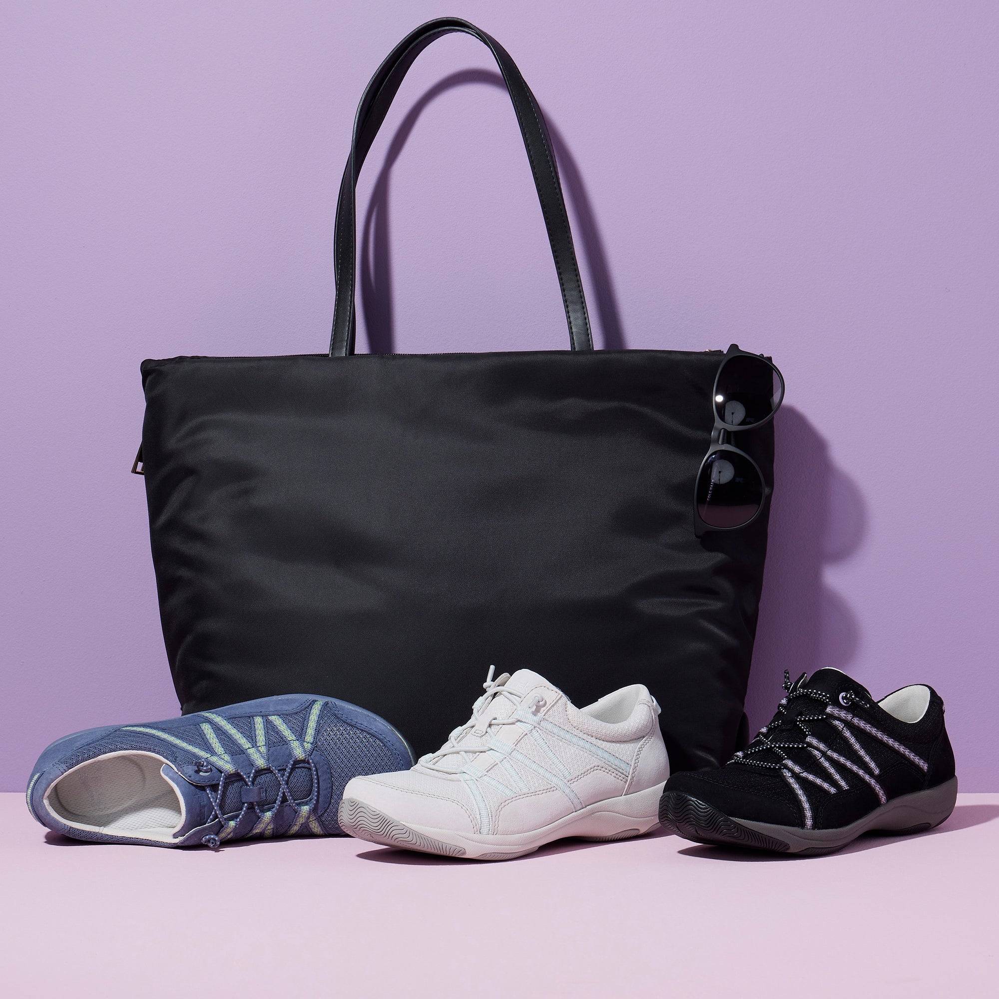 Three different colors of a lightweight and breathable sneaker that's great for travel.
