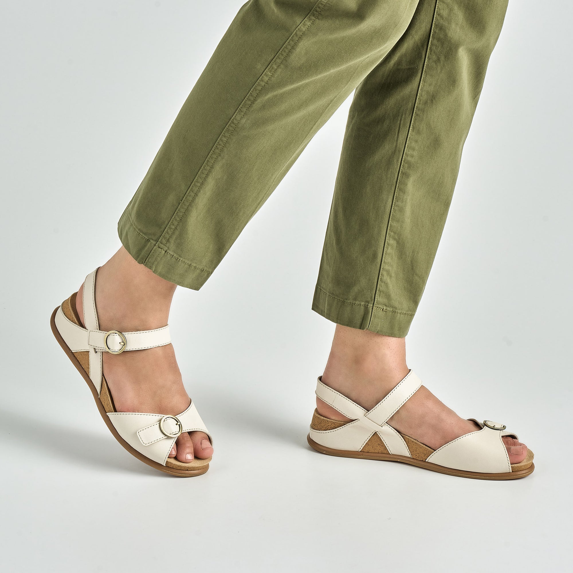 Close up of ivory open toe mary janes.