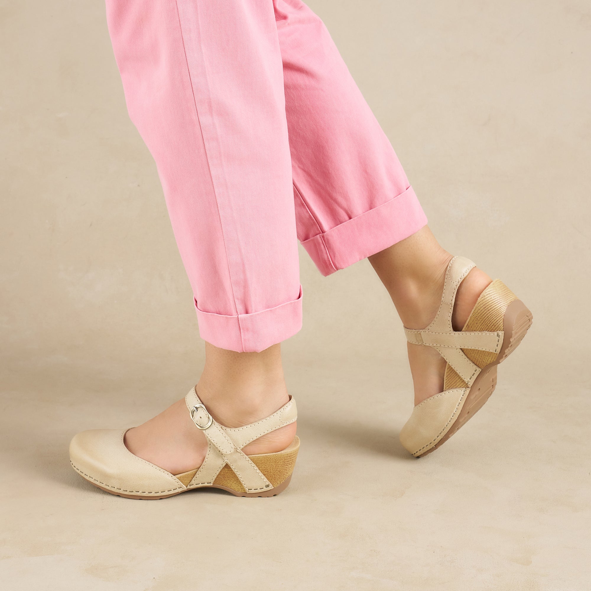 Close up of ivory wedge mary janes.
