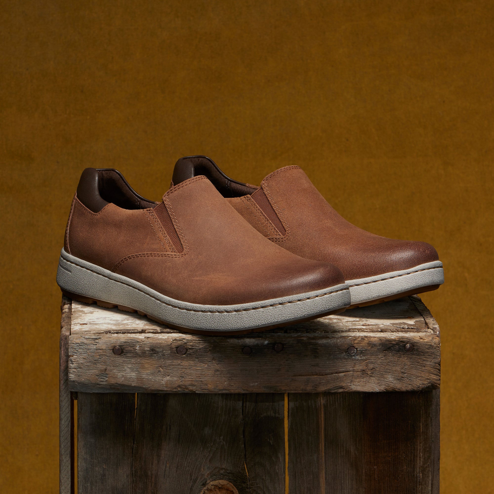 Men's slip-on sneakers in soft brown leathers with a casual outsole.