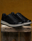 Men's slip-on sneakers in soft black leathers with a casual outsole.