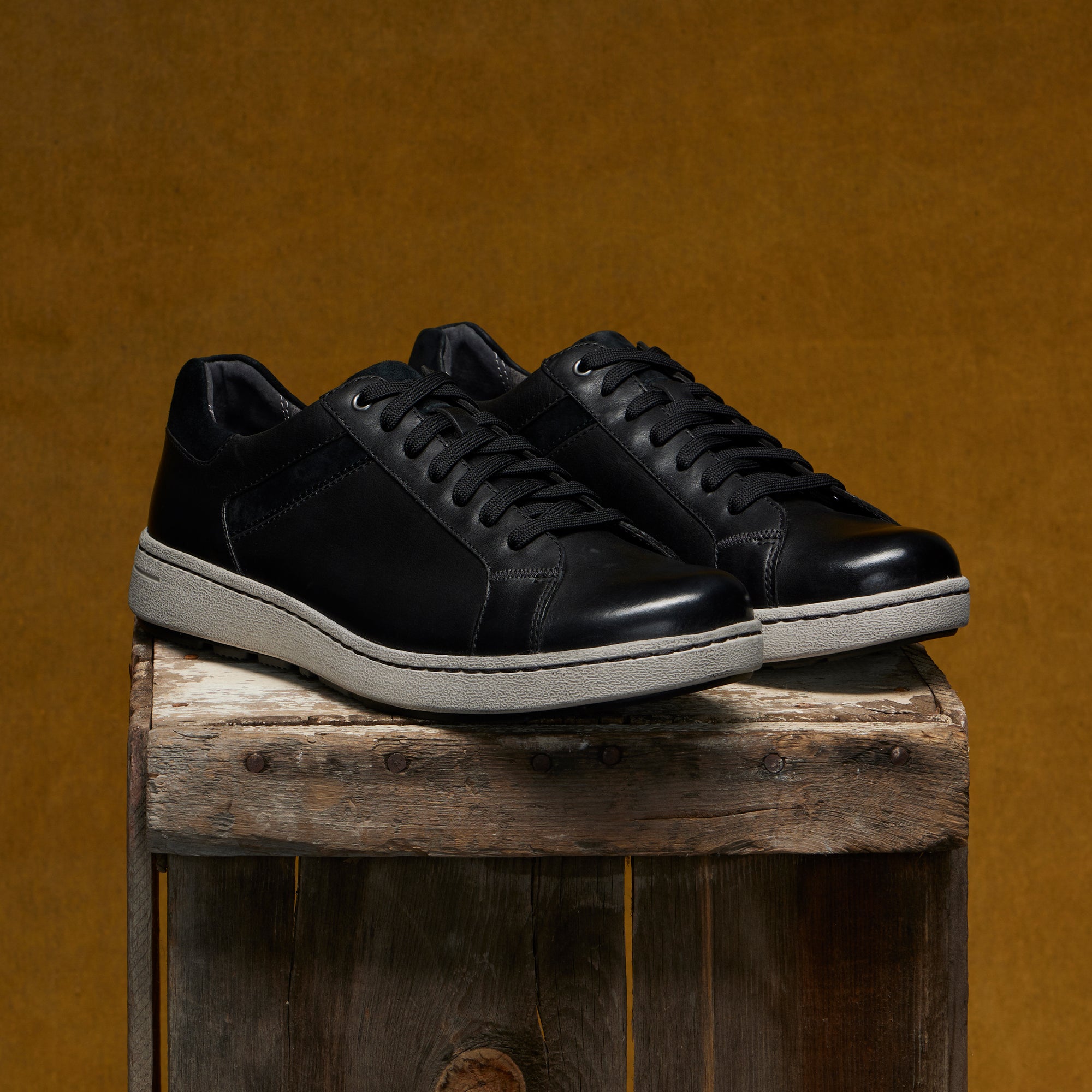Men's slip-on sneakers in soft black leathers with a casual outsole.