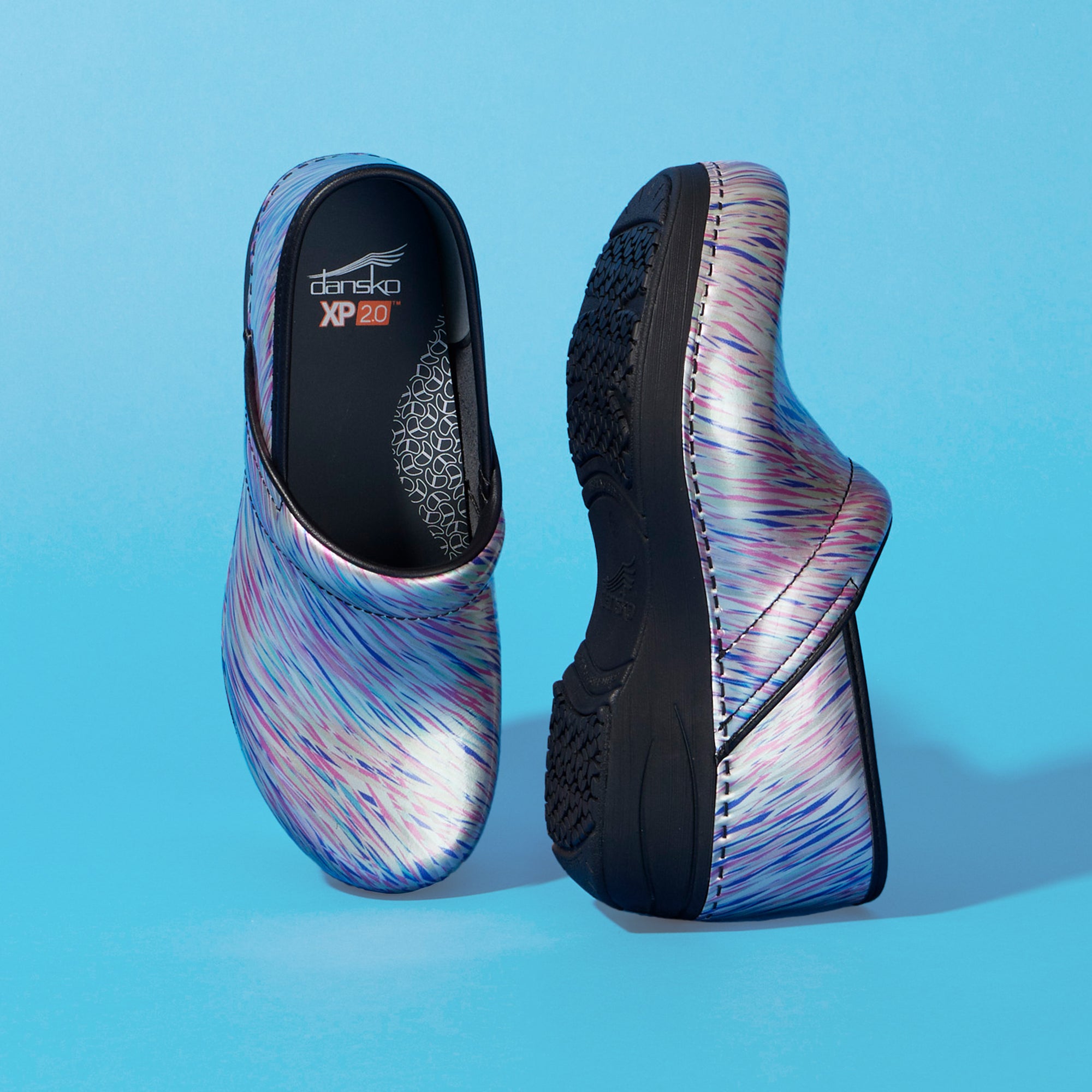 A blur pastel patent leather print of the XP 2.0 clog with arch support.