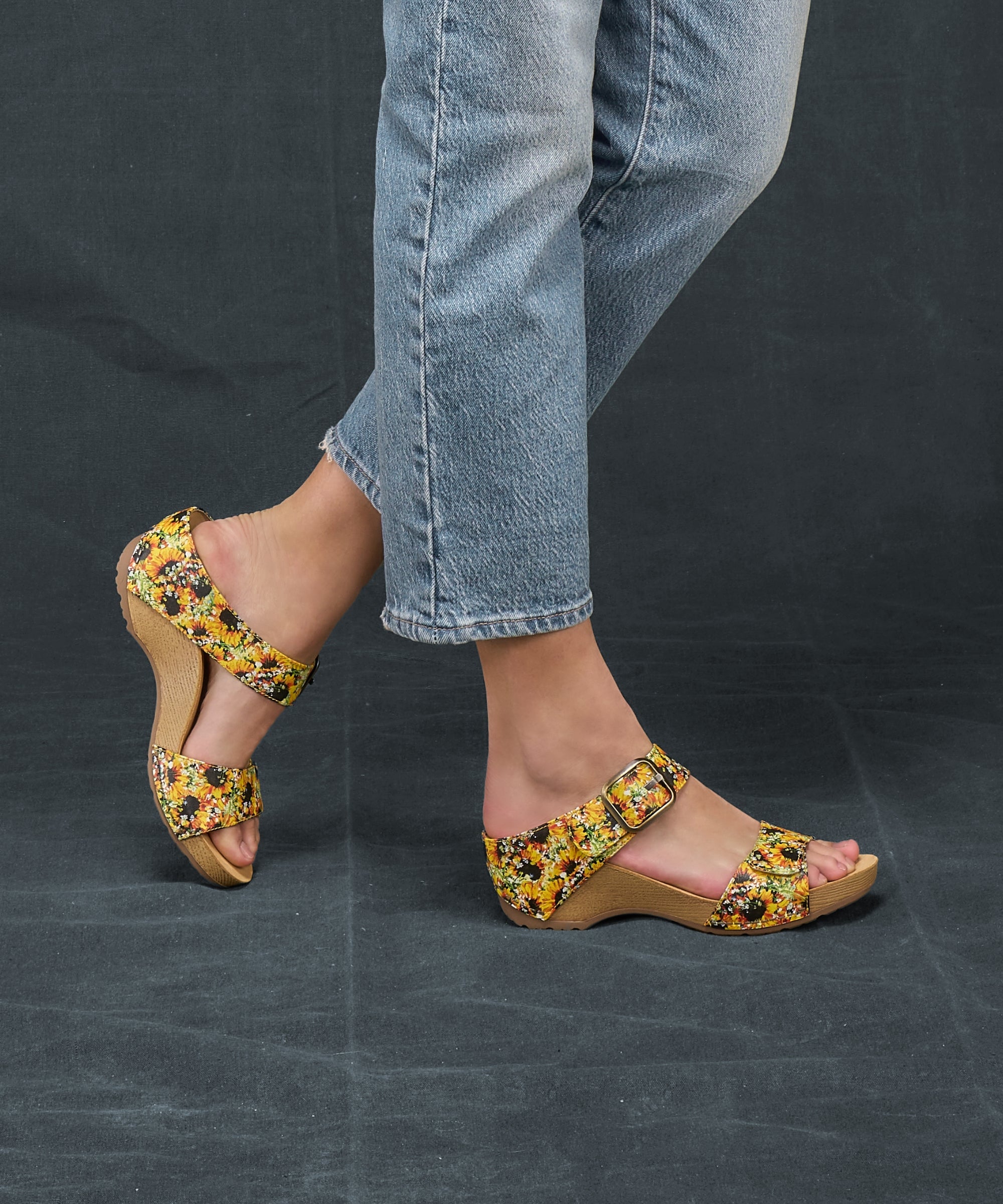 A close shot of vibrant sunflower two-strap sandals.