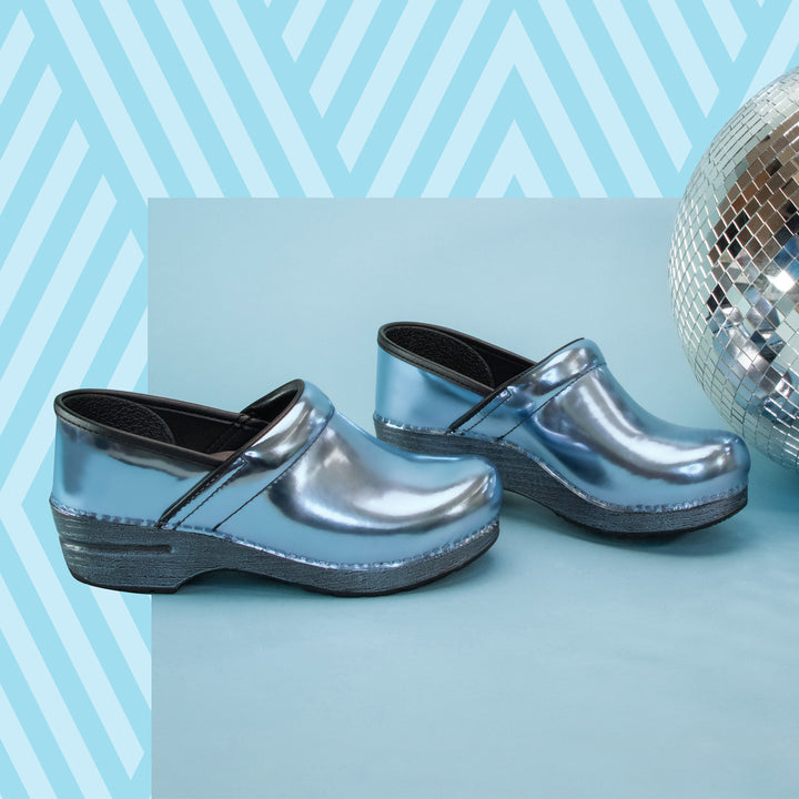 Blue chrome clogs shown on a blue background.