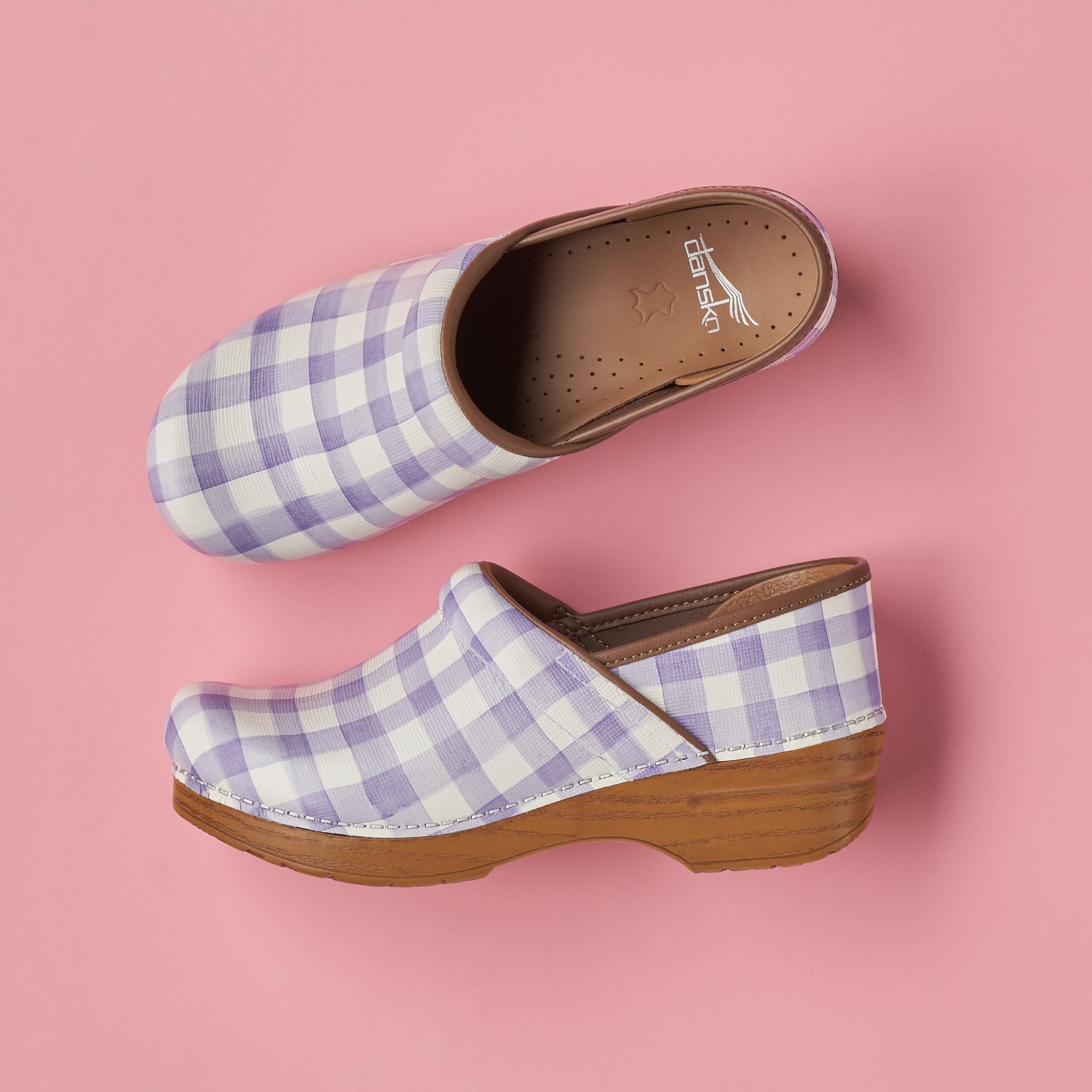 A closeup look at the lavender plaid clogs, including a look at the standard Dansko footbed.