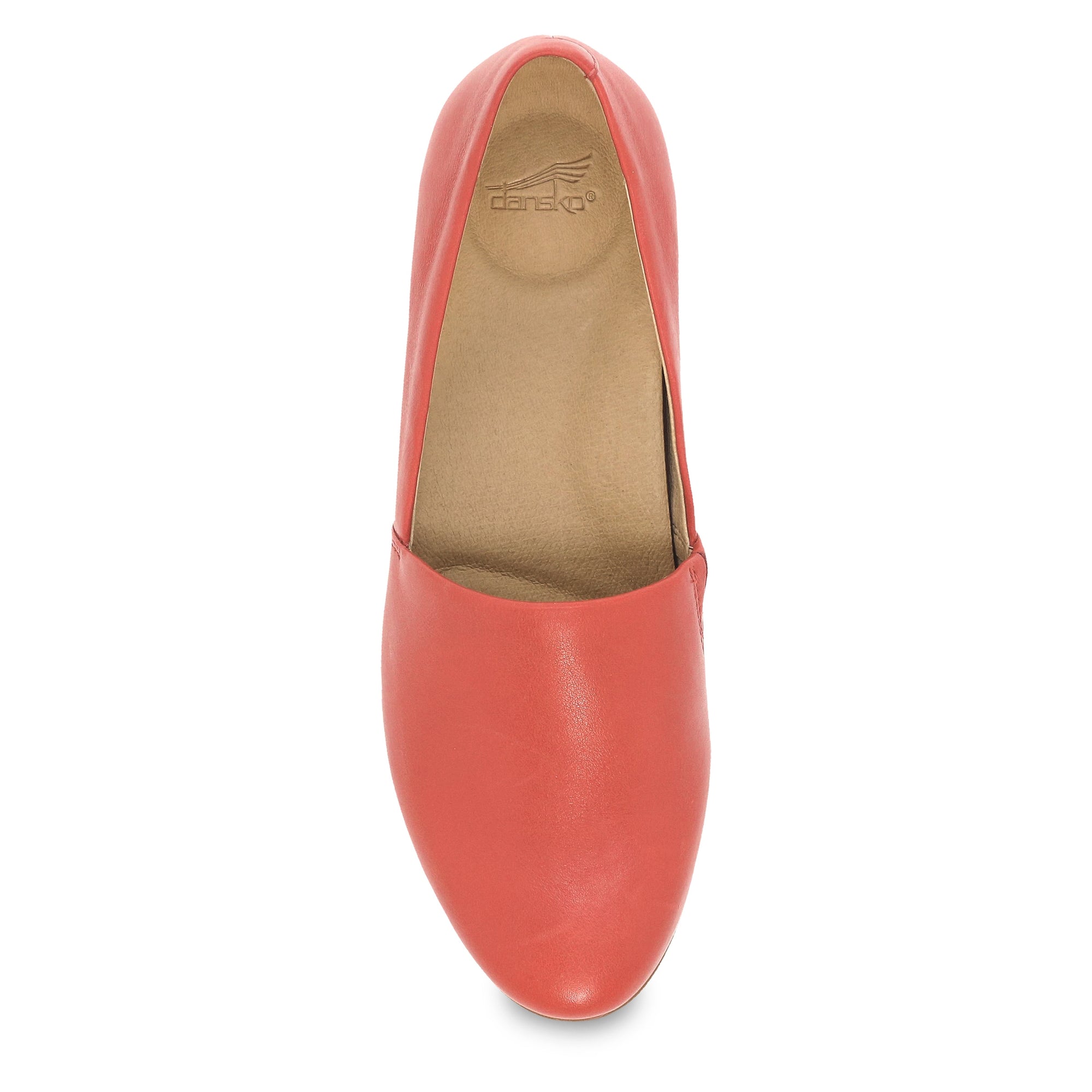 Top view of a red leather flat, showing a contoured footbed.