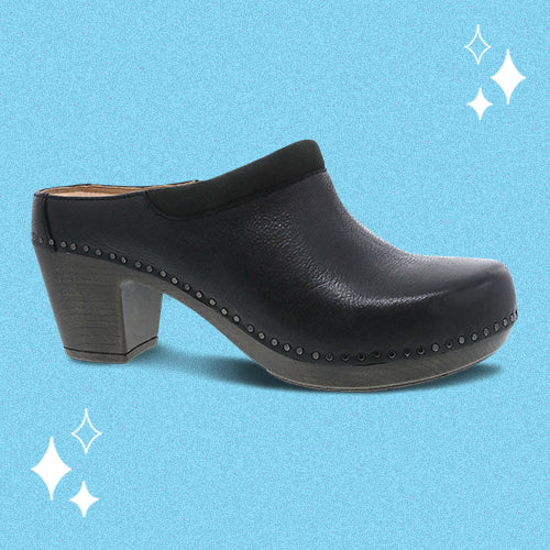 A black leather heeled clog shown on a bright blue background.