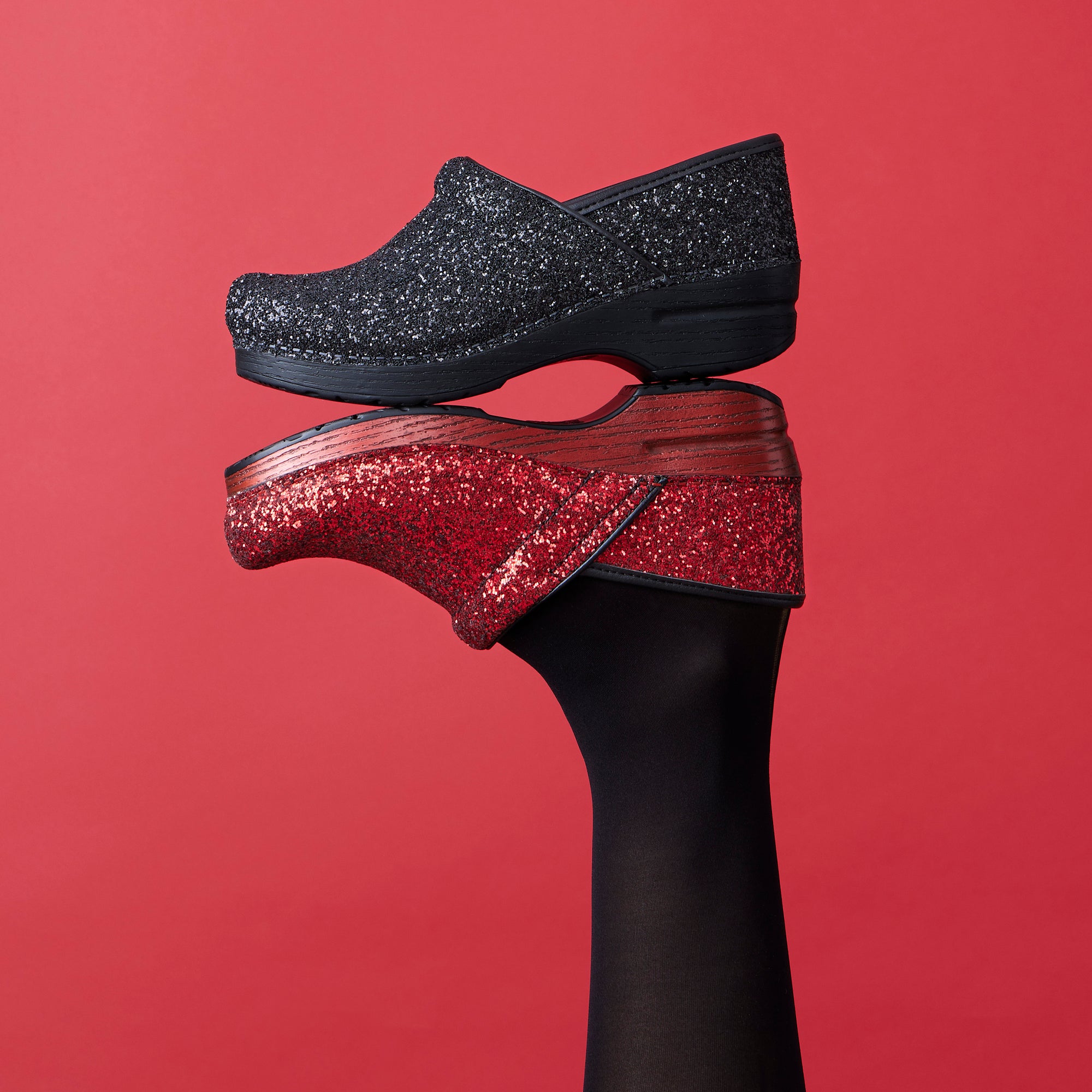 Sparkling and shining novelty clogs shown in red and black.