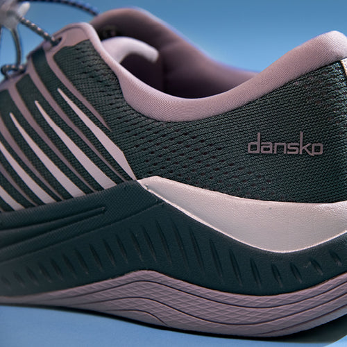 Lightweight mesh athletic sneakers from Dansko in a purple accented color.