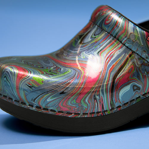 An exclusively designed clog from Dansko with colored marble detail.