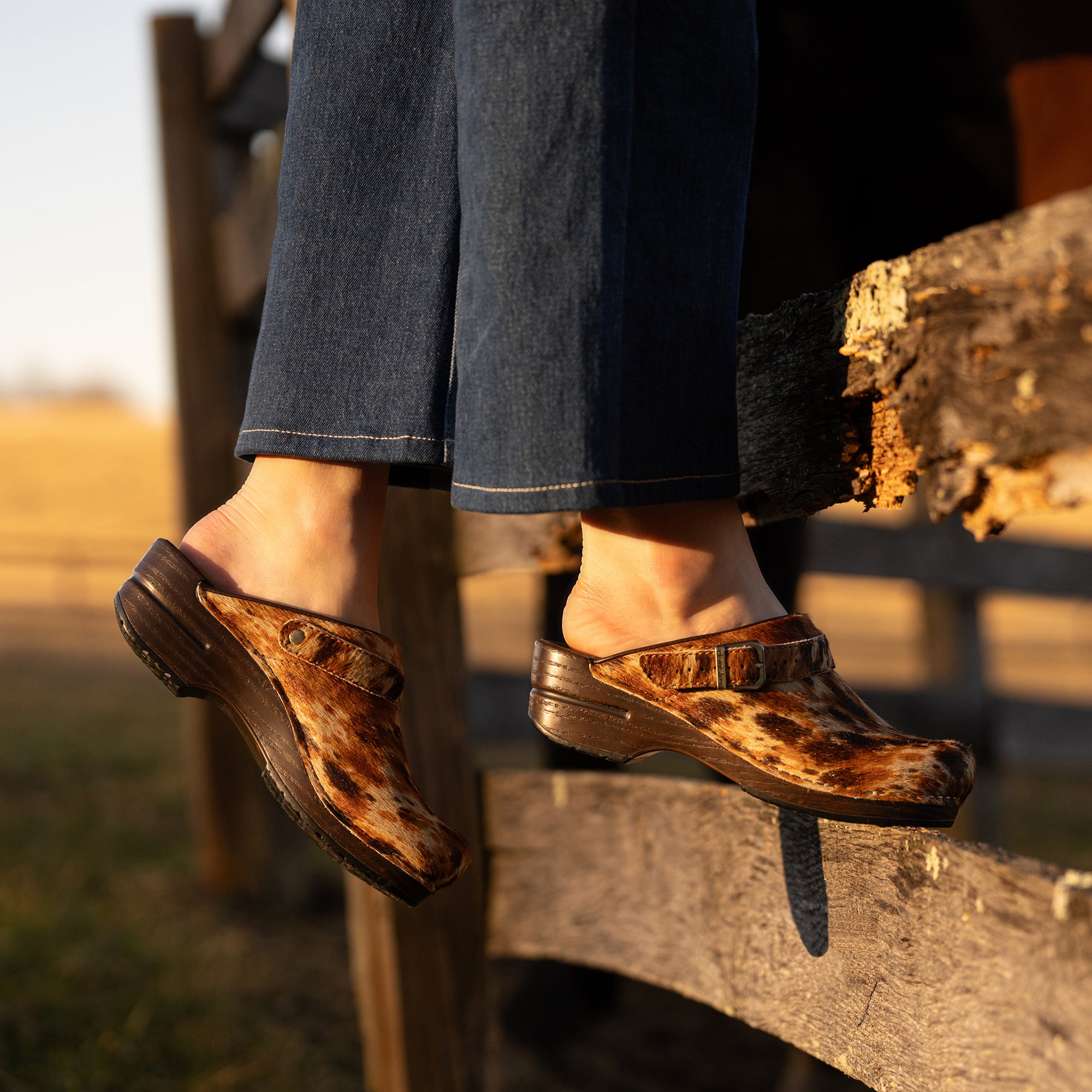 An on-foot look at spotted haircalf slingback clogs.