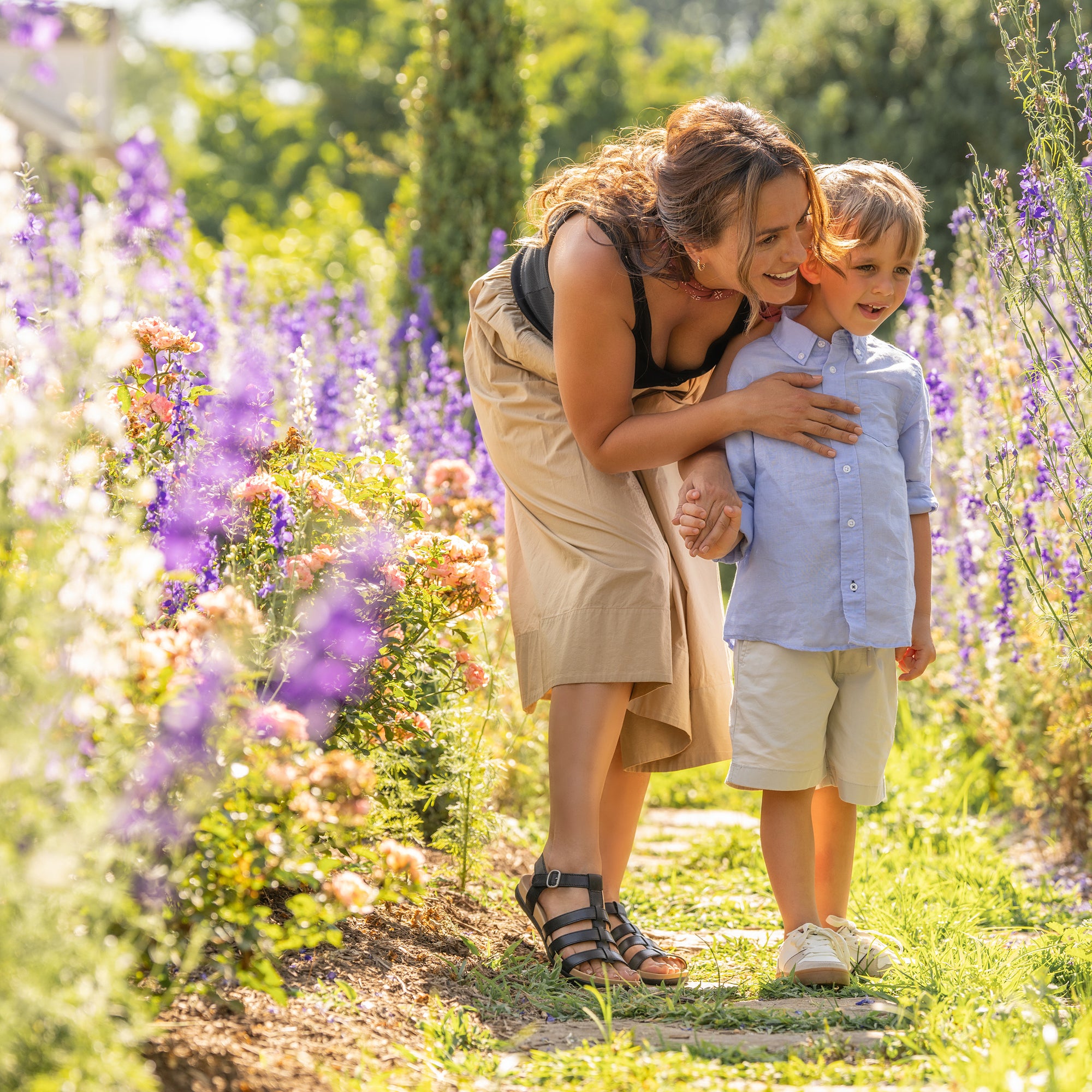 Mother and son in lavender field. 