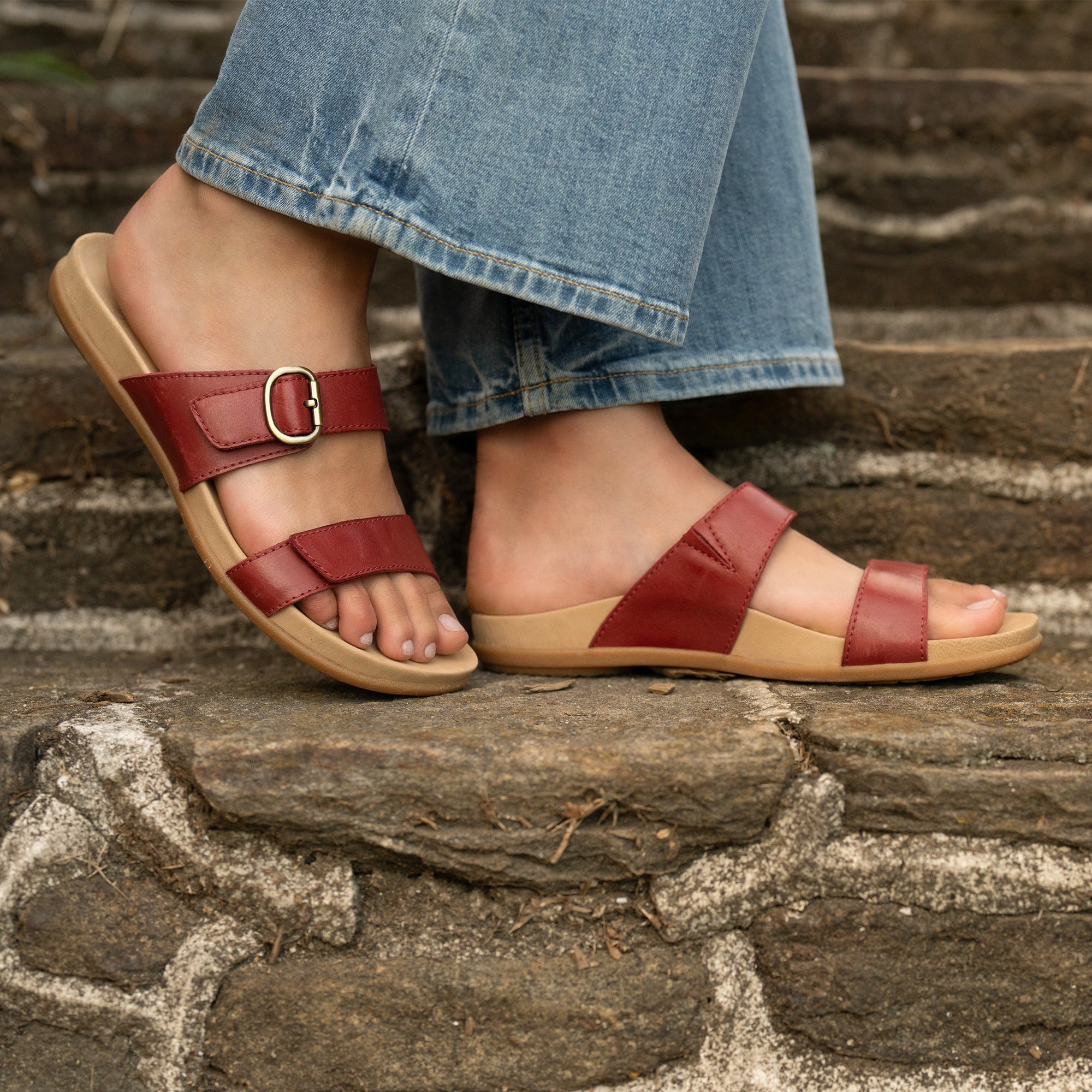 Close up of red strappy flat sandals.