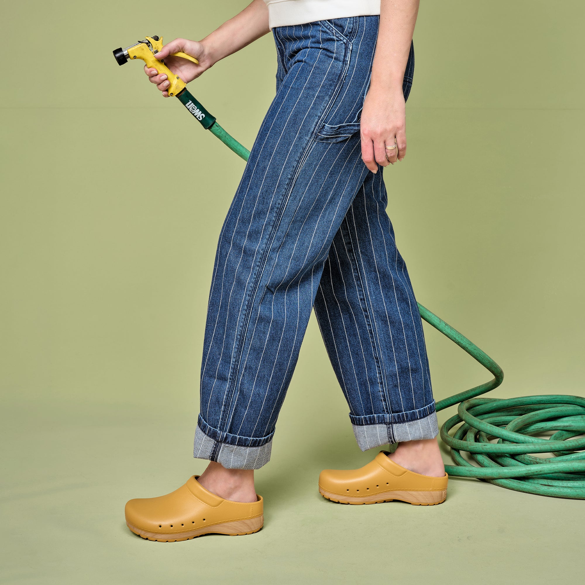 Yellow EVA clogs with a faux wood sole are great to use in the garden.