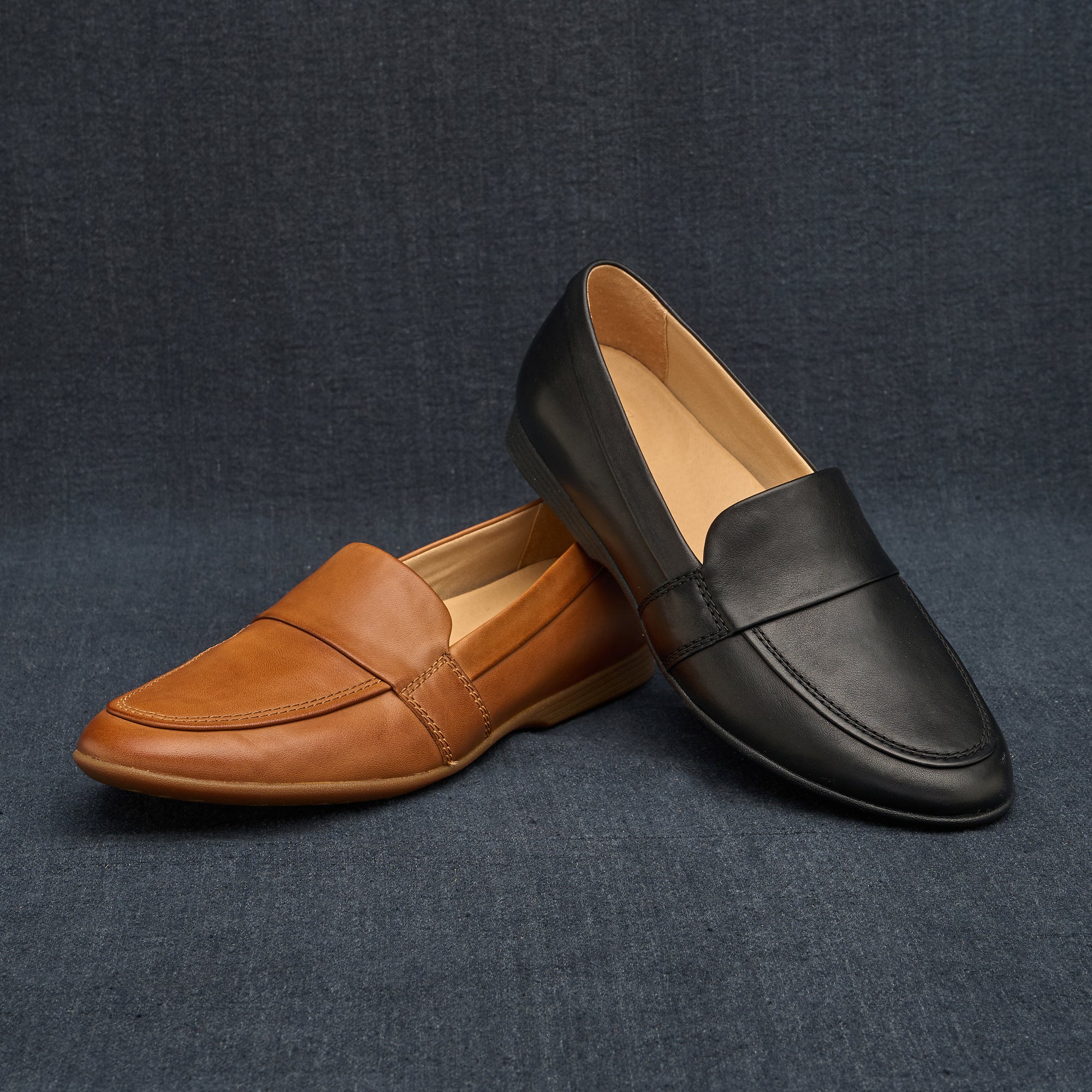 Black and brown leather options of a sleek flat loafer.