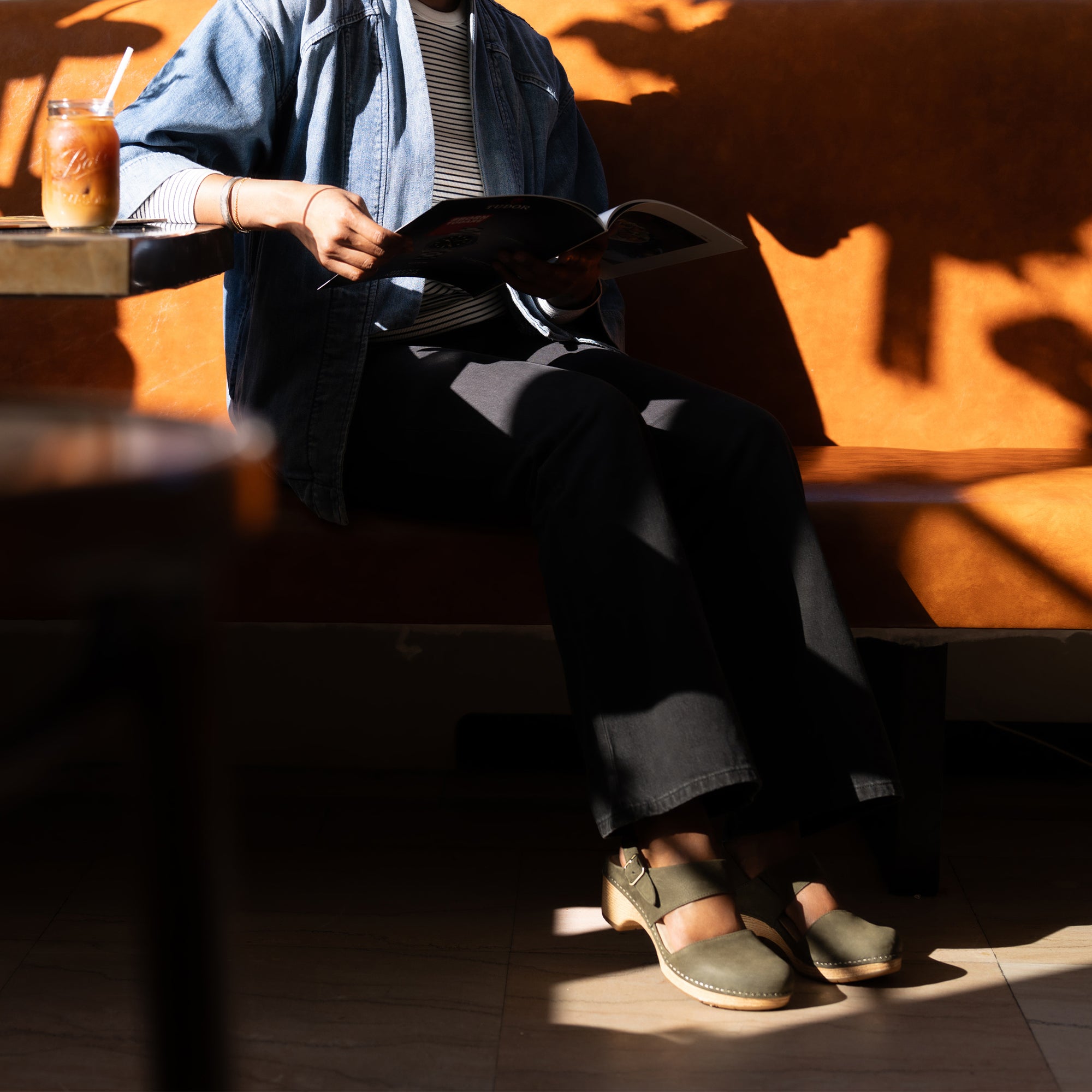 A pair of ivy transitional sandals prominently shown in natural light.