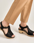 Close up of black open toe mary jane.