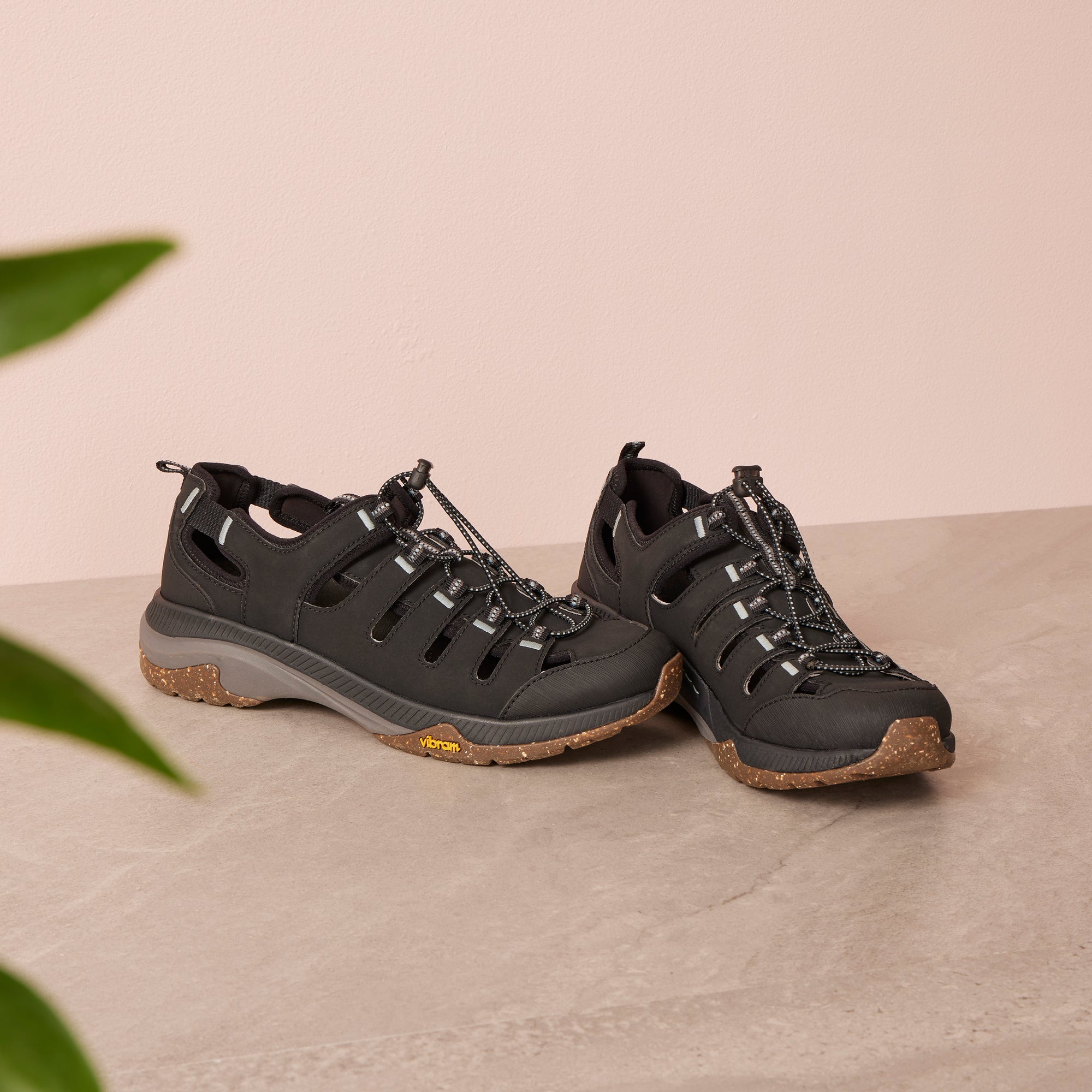 A black sandal sneaker with a durable Vibram rubber outsole.