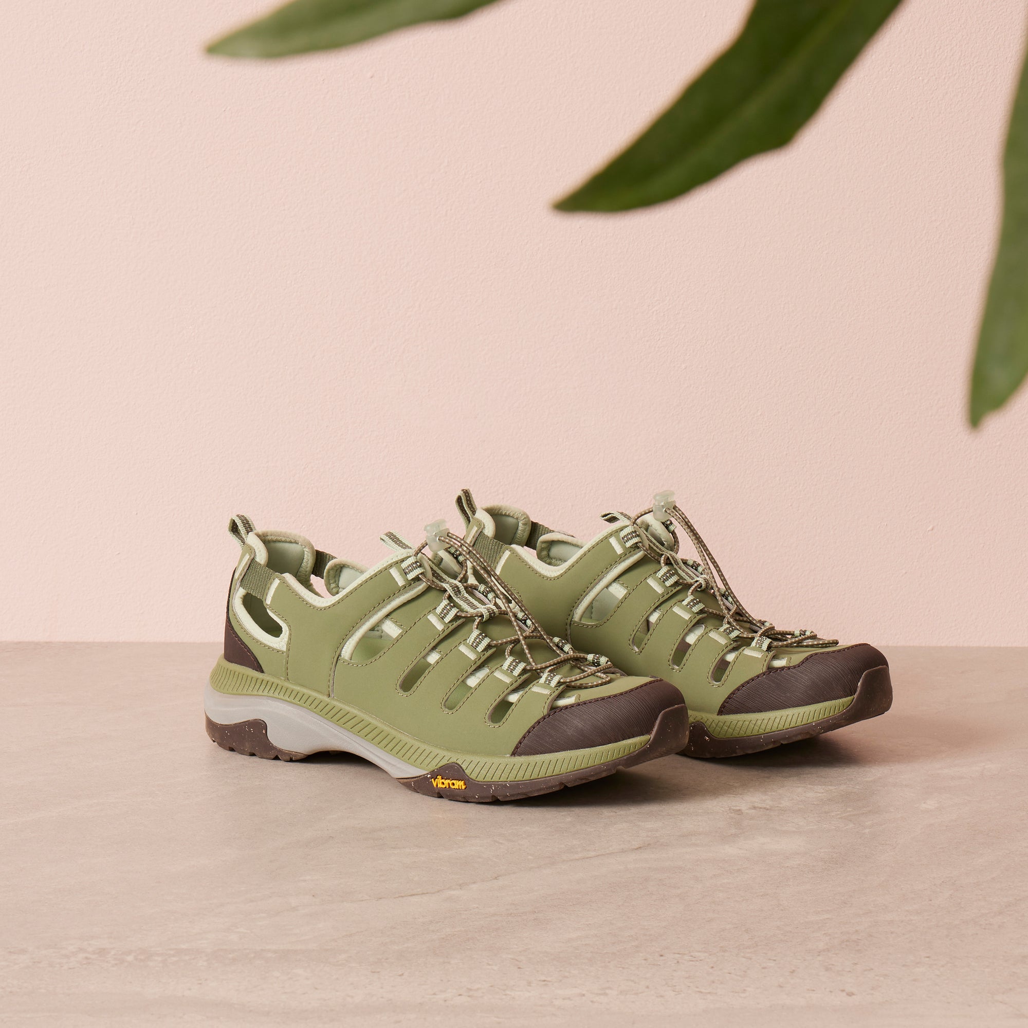 A green sandal sneaker with a durable Vibram rubber outsole.