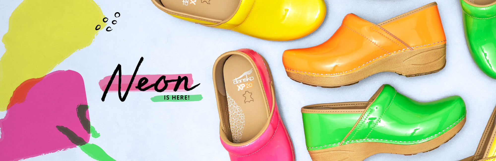 Colorful clogs in neon colors with 'Neon is here!' text on a white background