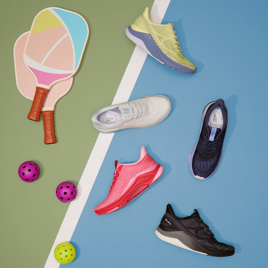 A pickleball set shown with a supportive athletic shoe shown in pink, navy, white, yellow, and black.