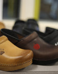 Some classic clogs shown with personalization options.