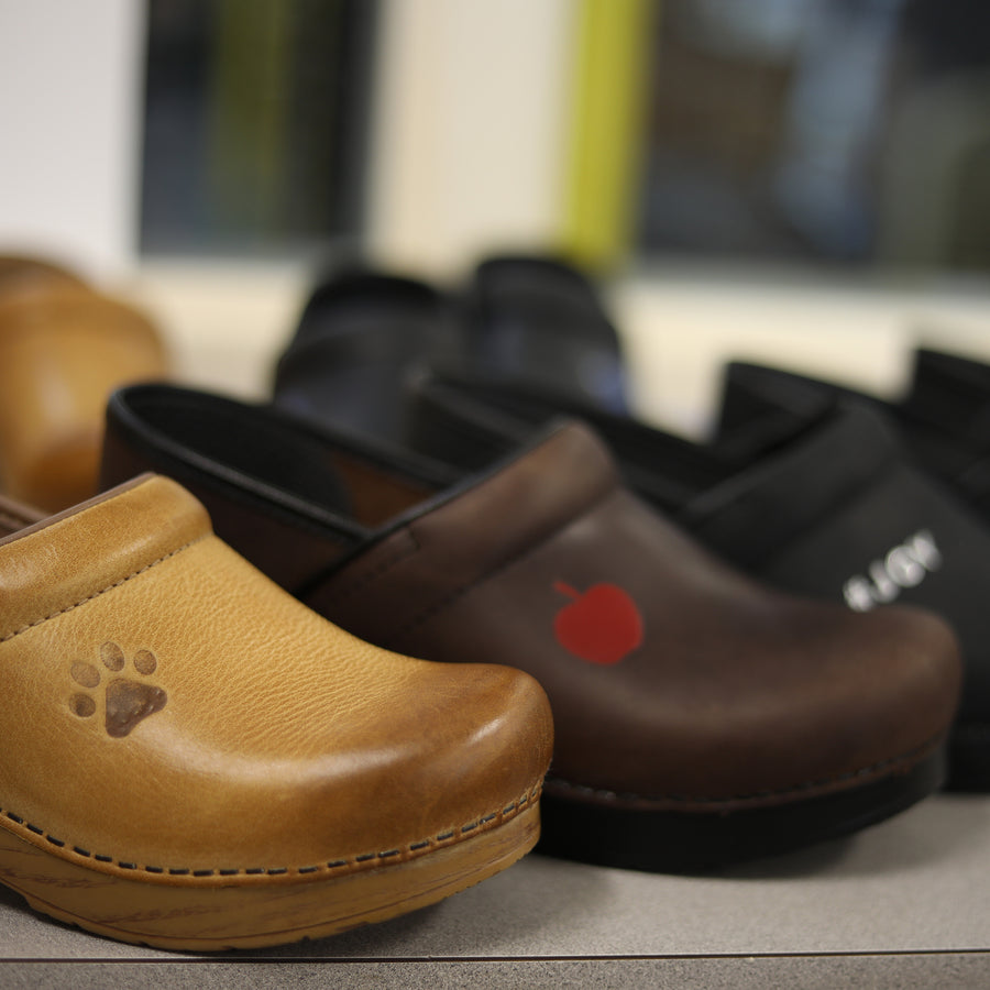 Some classic clogs shown with personalization options.