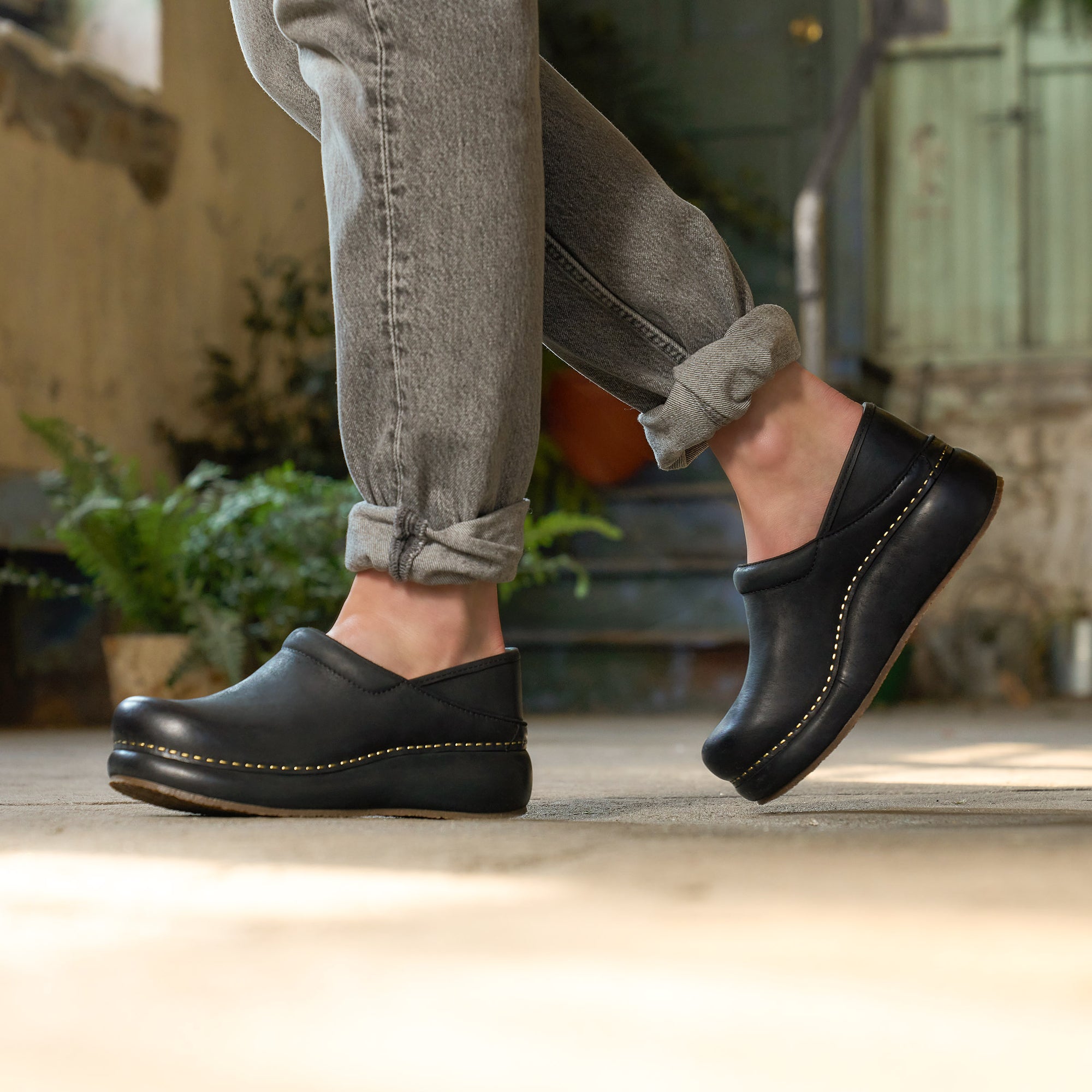 Close up of black platform clog.