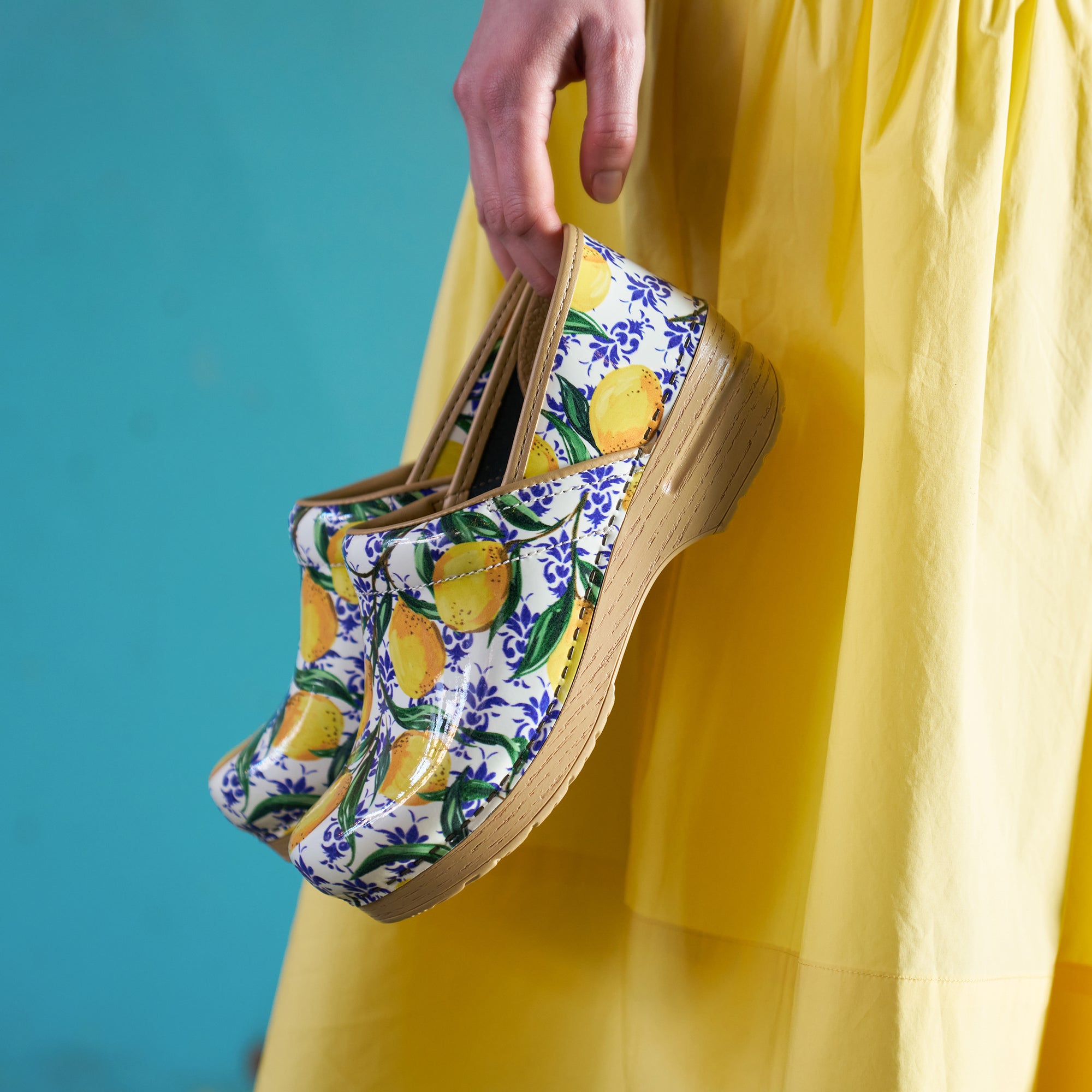 Close up of lemon print clogs.