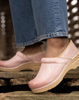 An on-foot look at the neutral pink colored Professional clogs.