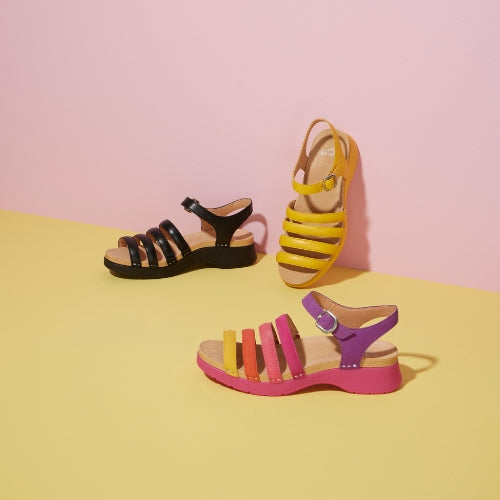 Three colorways of a strappy summer sandal ranging from neutral black to exciting multi.