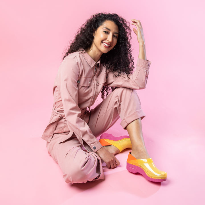 Yellow Translucent clogs with pink coveralls.