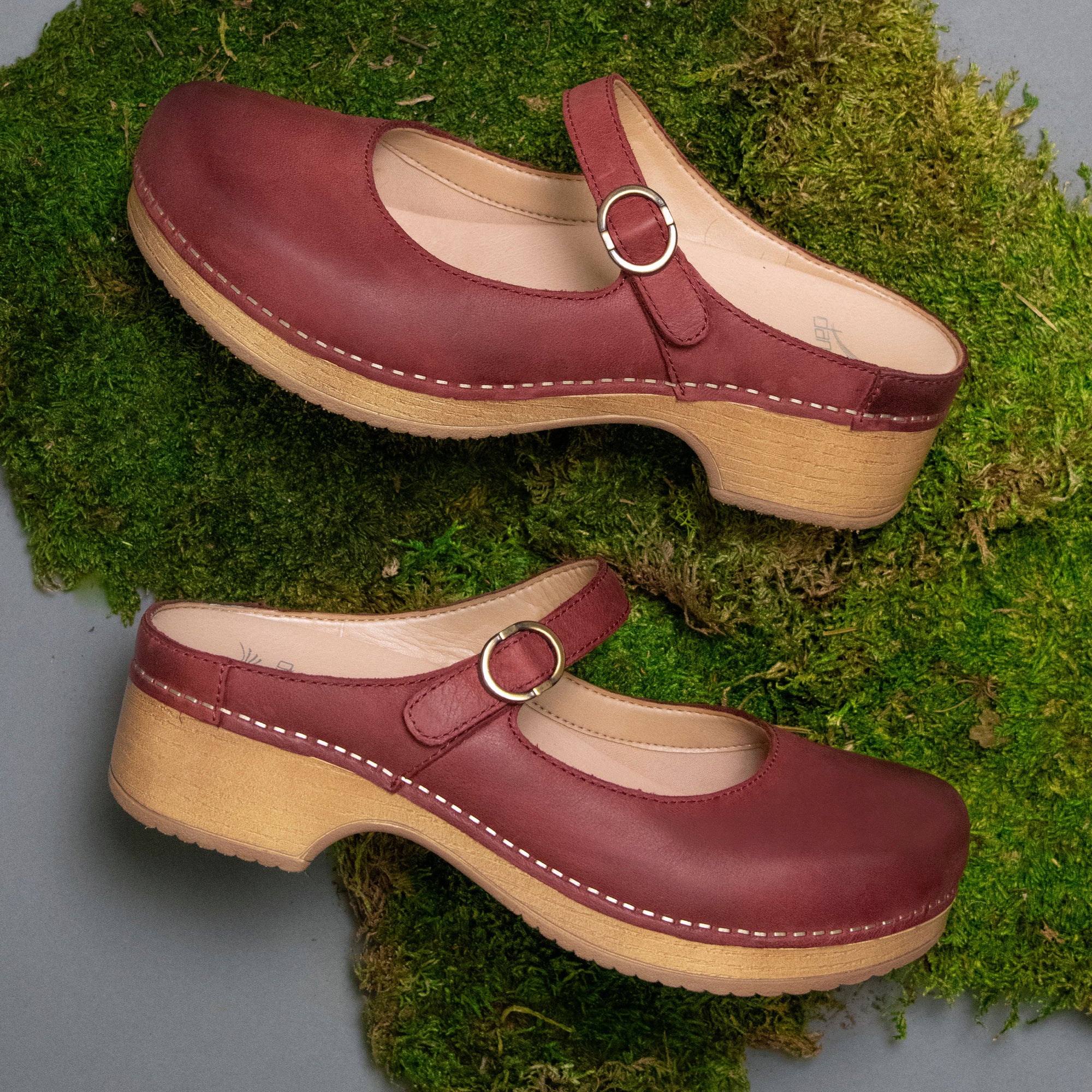 Mary Jane mule clogs in a rich red tone.