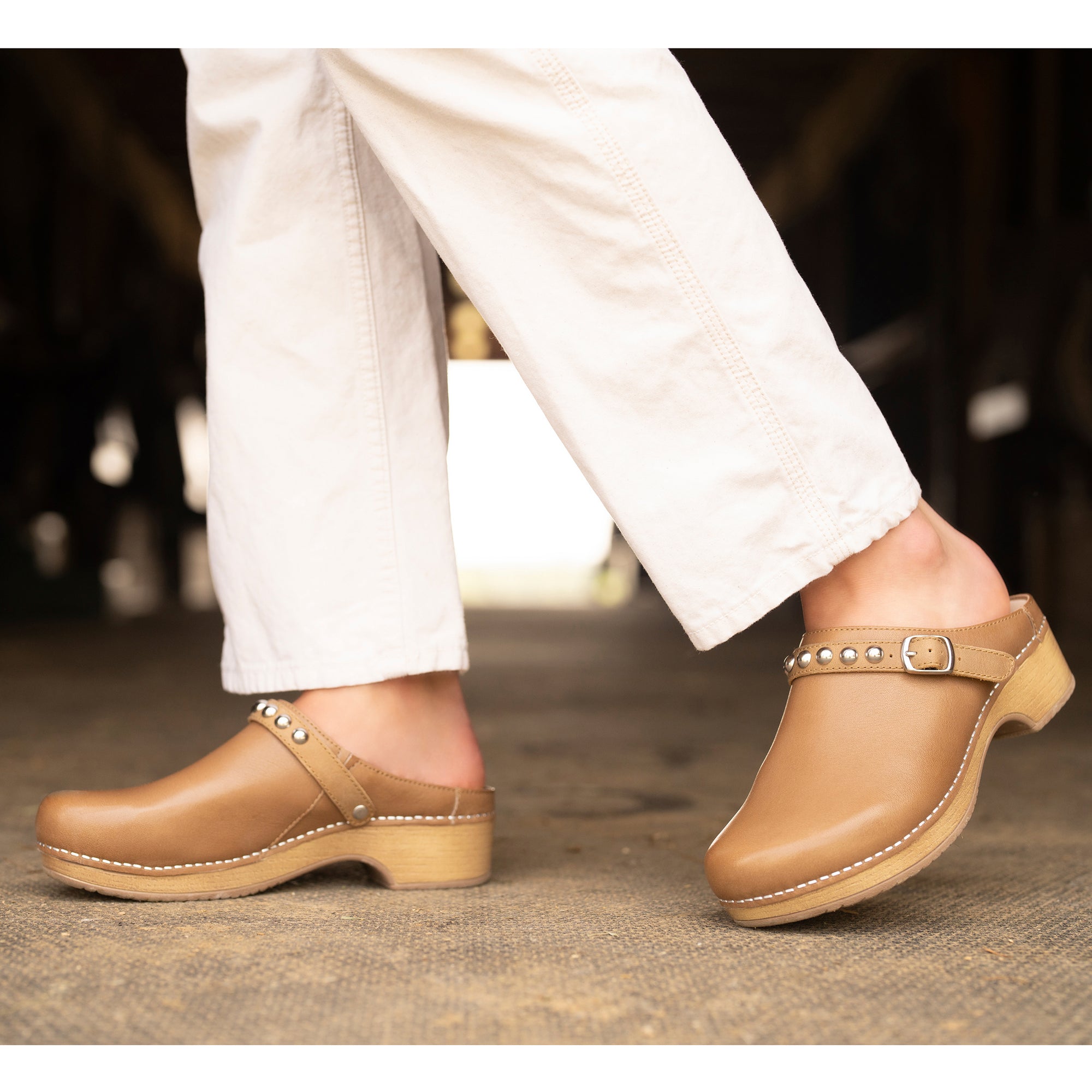 Stylish tan mule clog with trendy design.