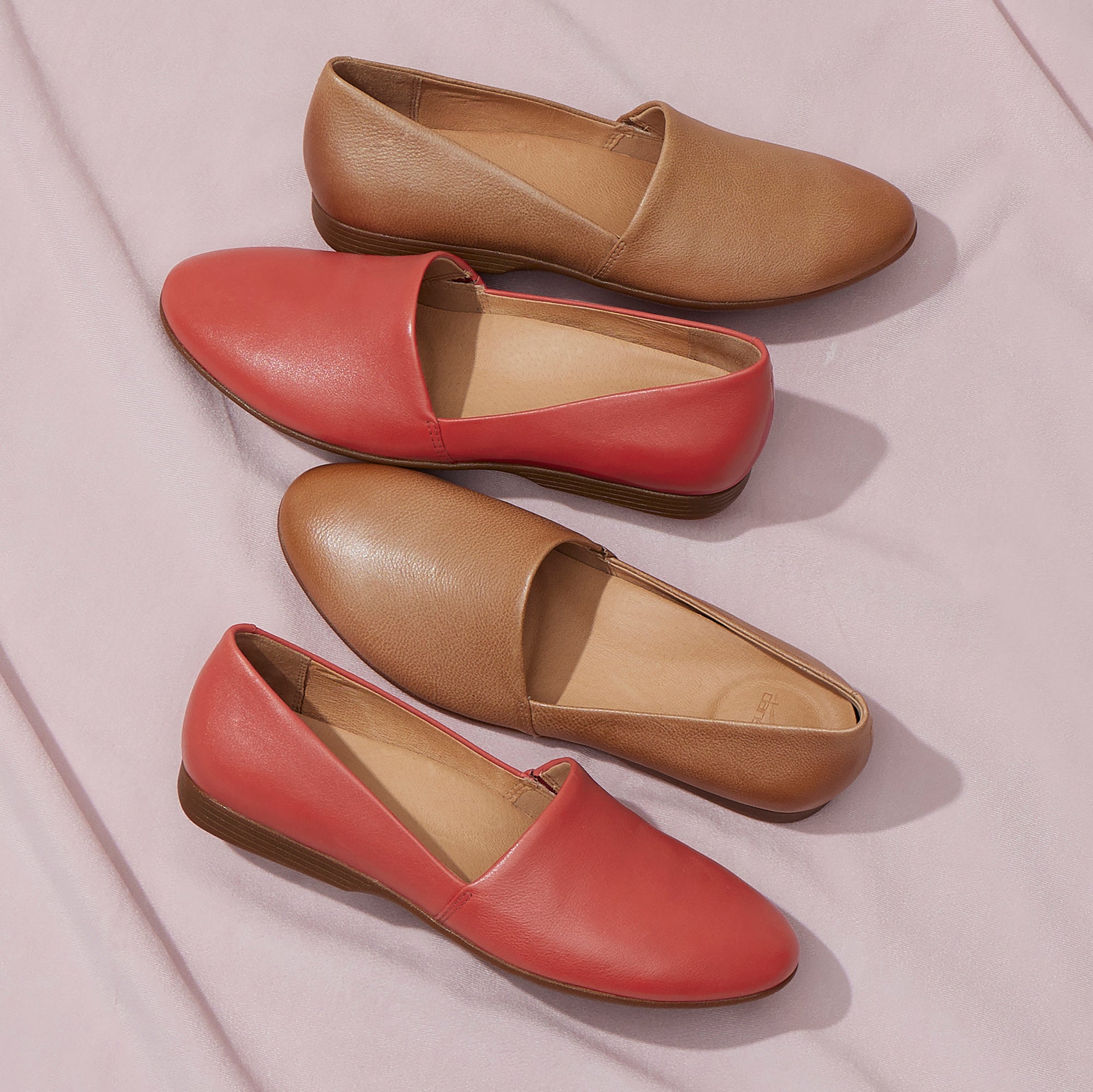 Two colors of a leather flat with a contoured footbed.