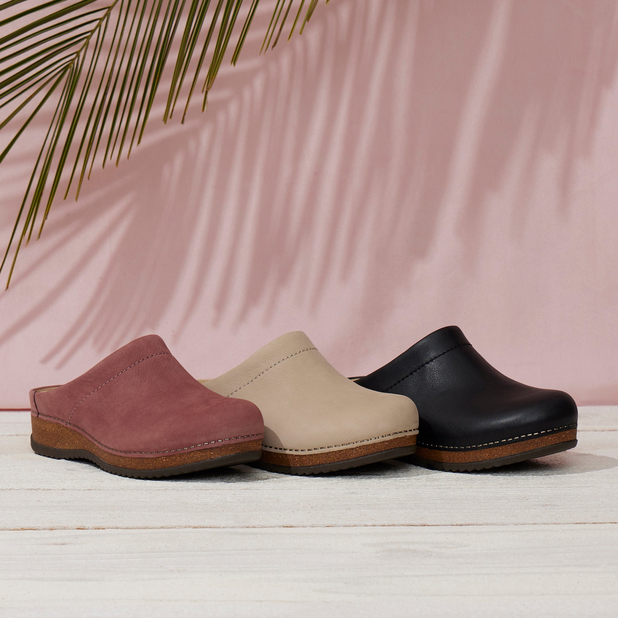Three colors of a comfortable backless mule clog.