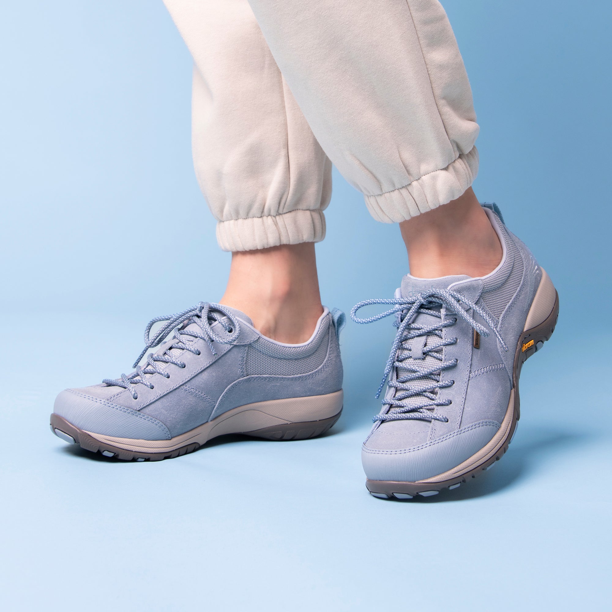 A supportive and durable outdoor shoe in a stylish light blue color.