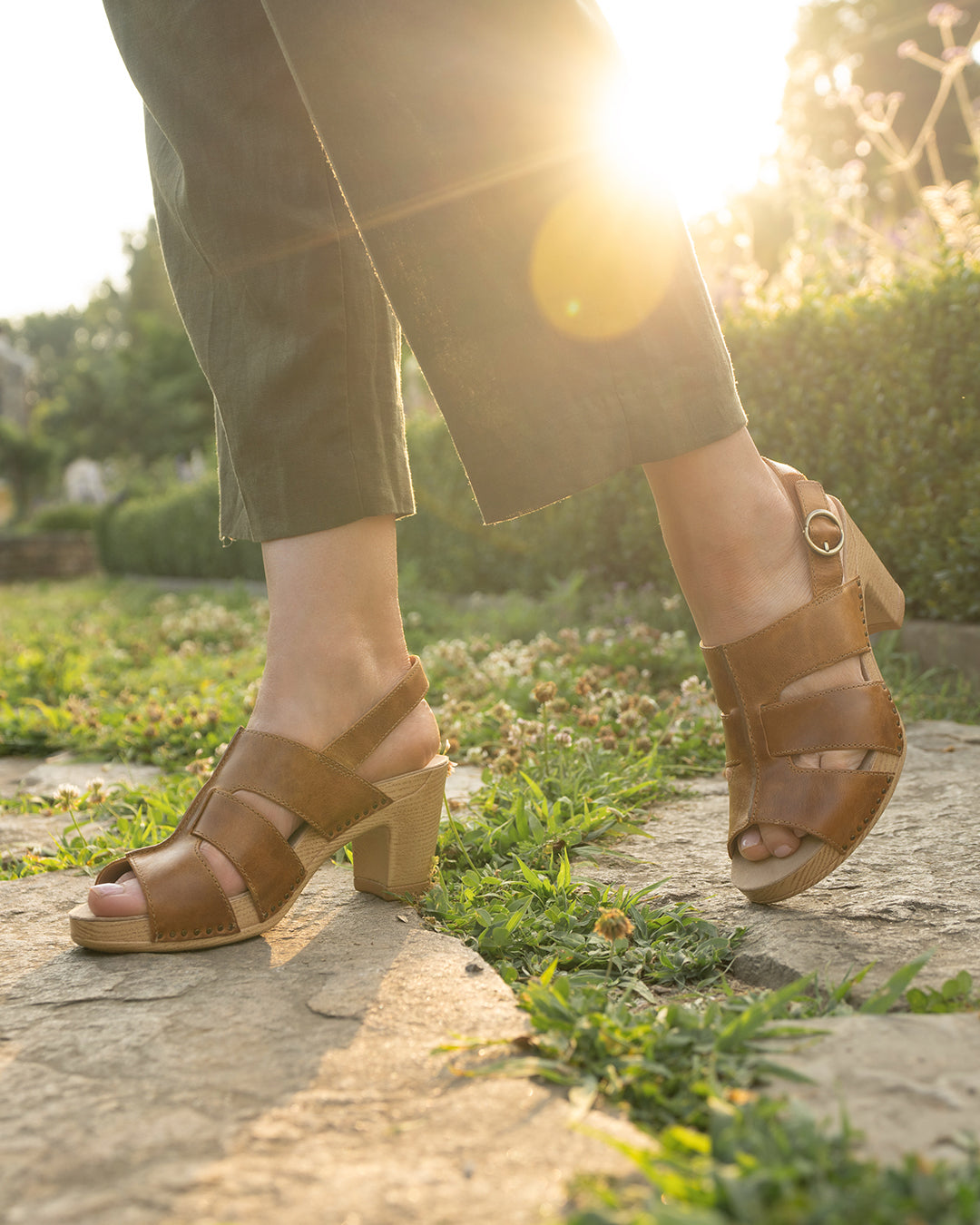 Close up of heeled tan sandals.