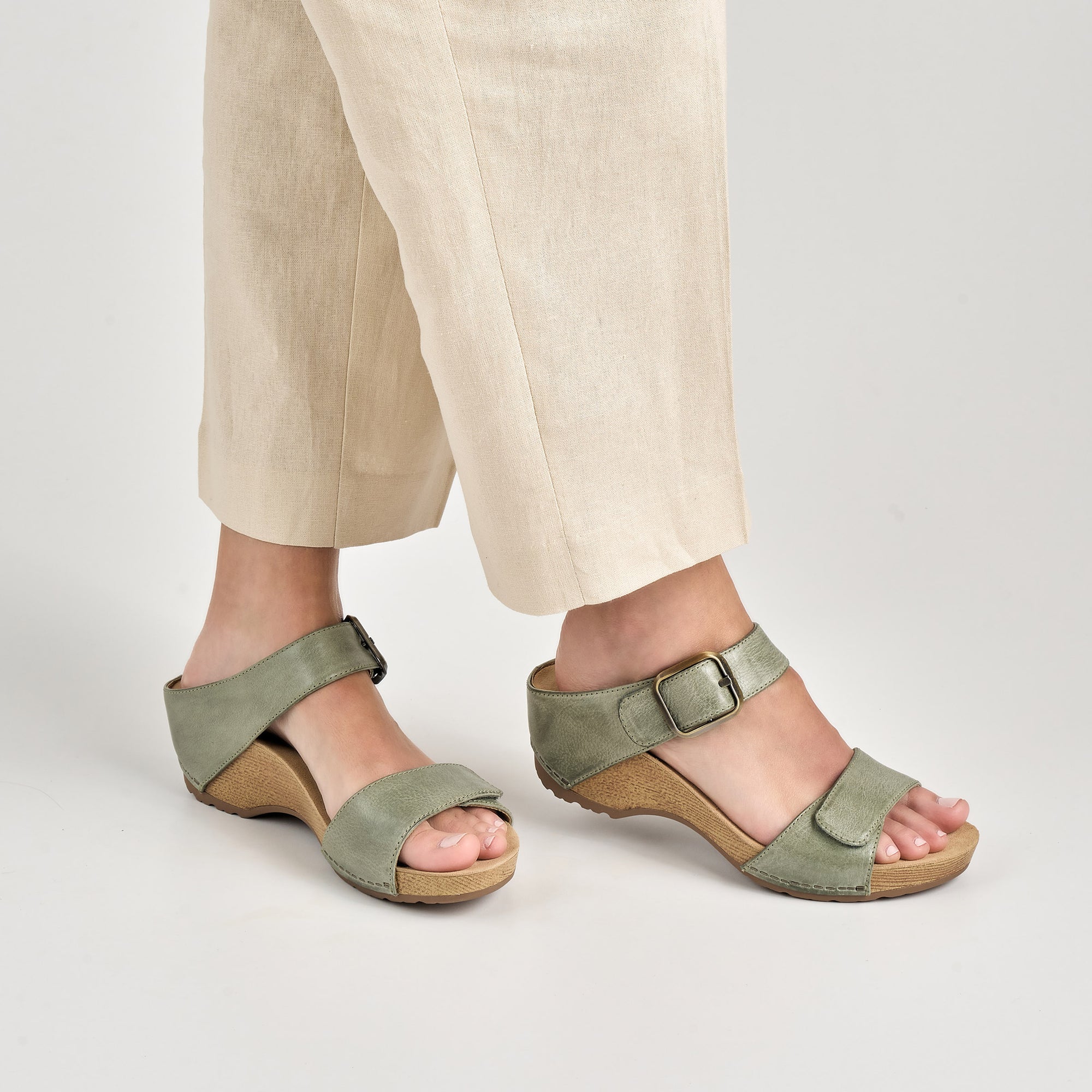 Close up of sage heeled sandals.