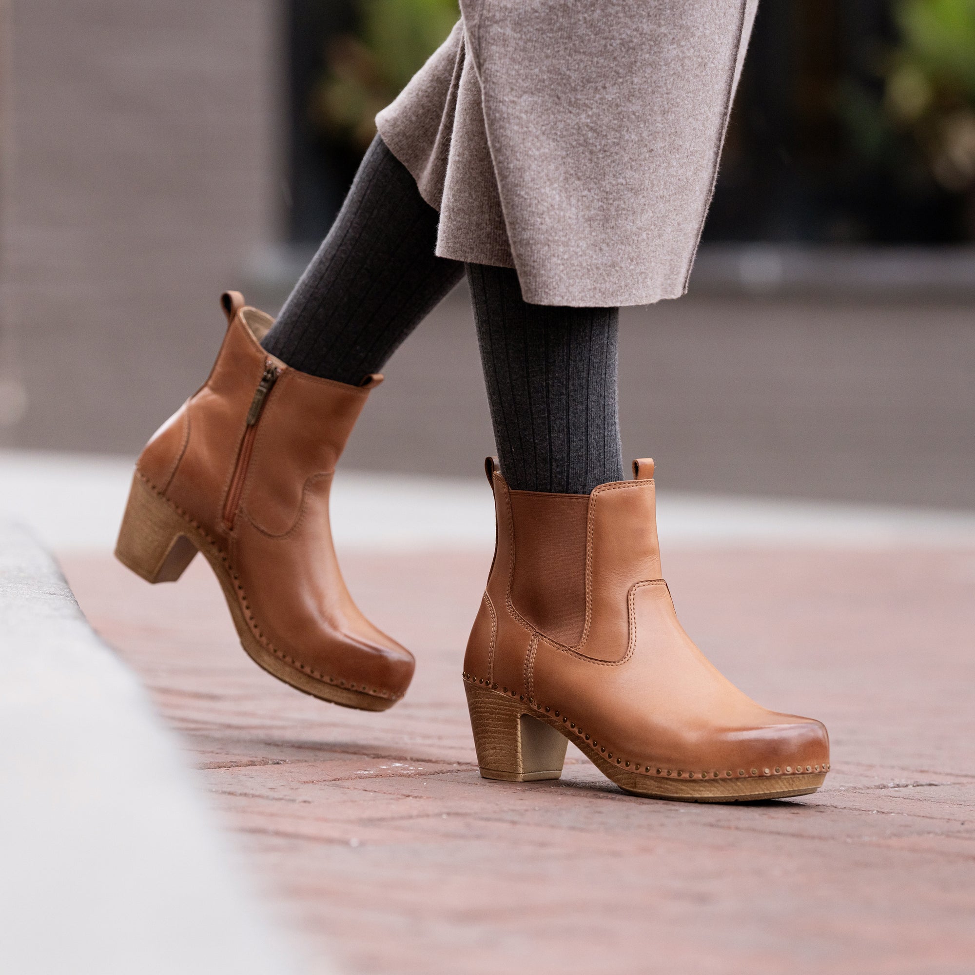 An on-foot shot of heeled brown booties.