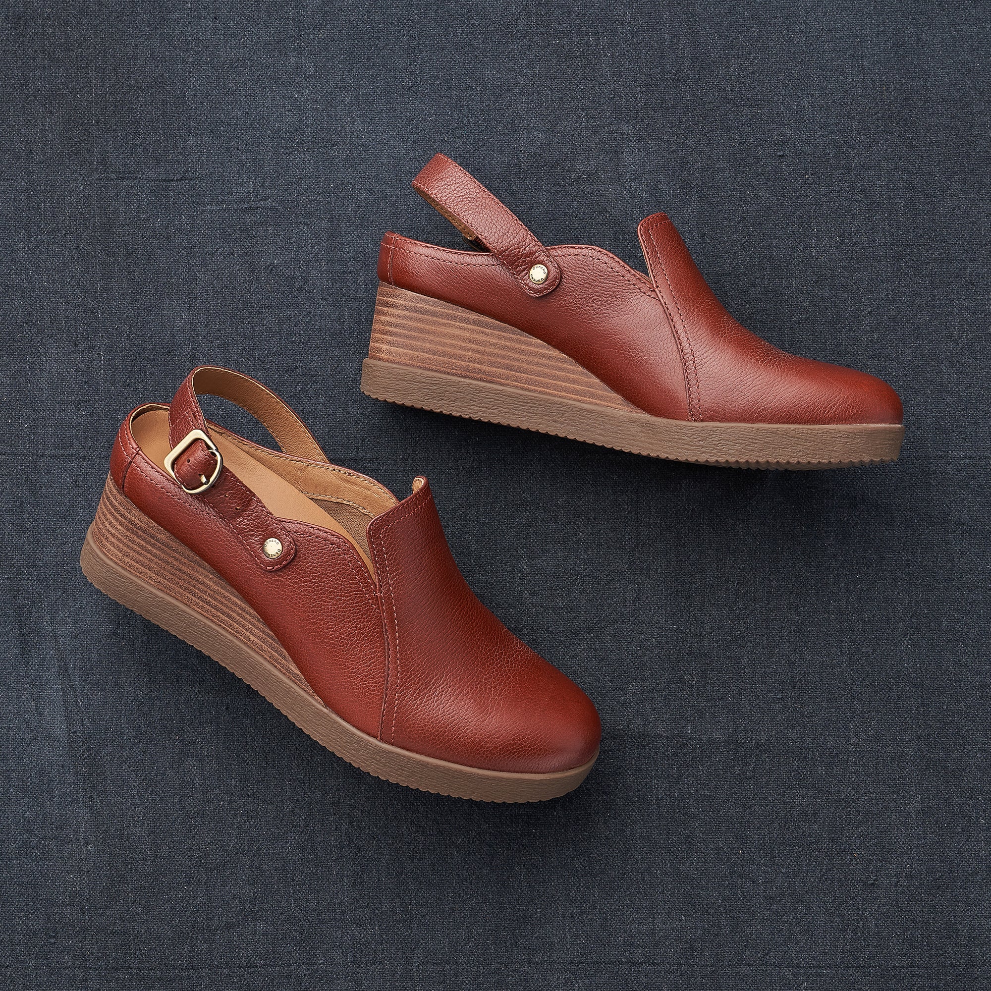 Slingback mules with a wedge in a rich red leather.