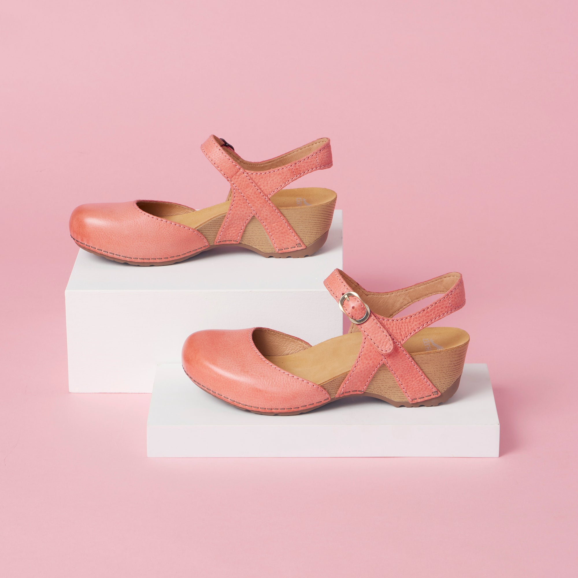 A close look at Mary Jane sandals in coral.