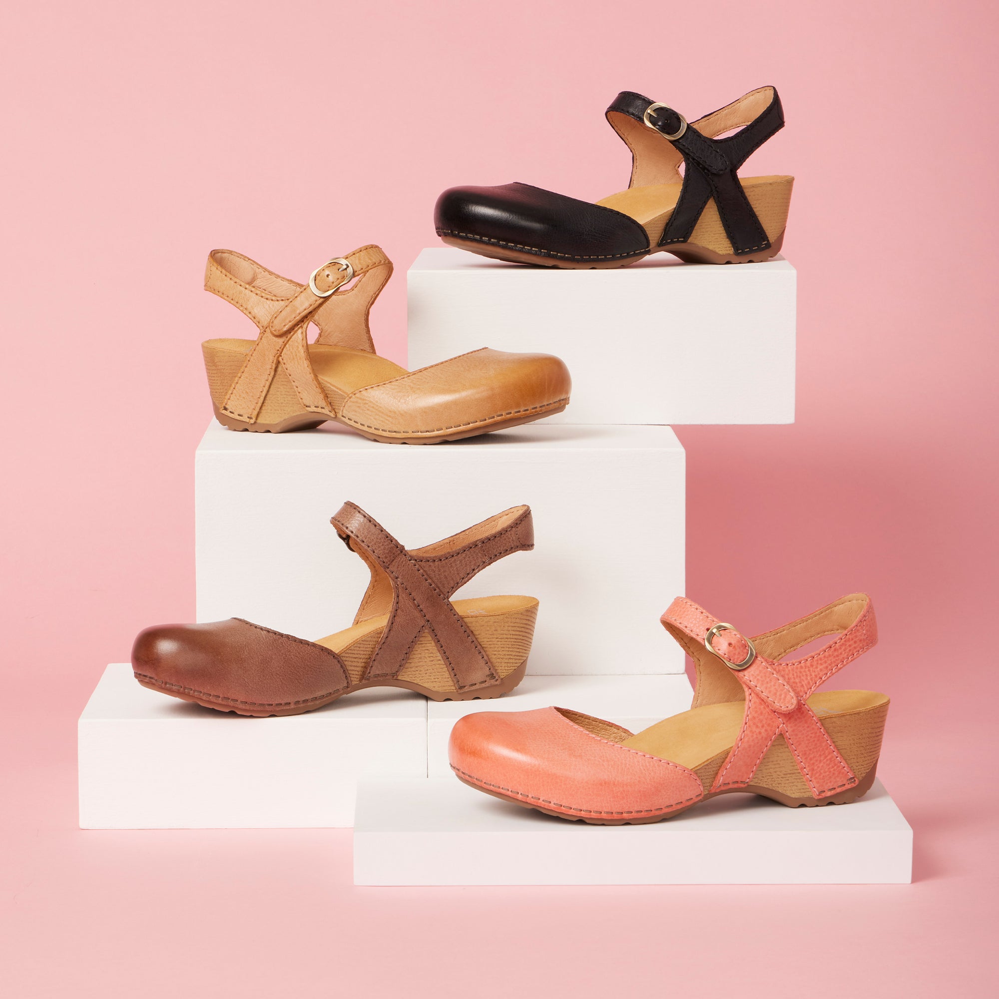 Four colors of a classic Mary Jane flatform sandal in pink, tan, brown, and black.